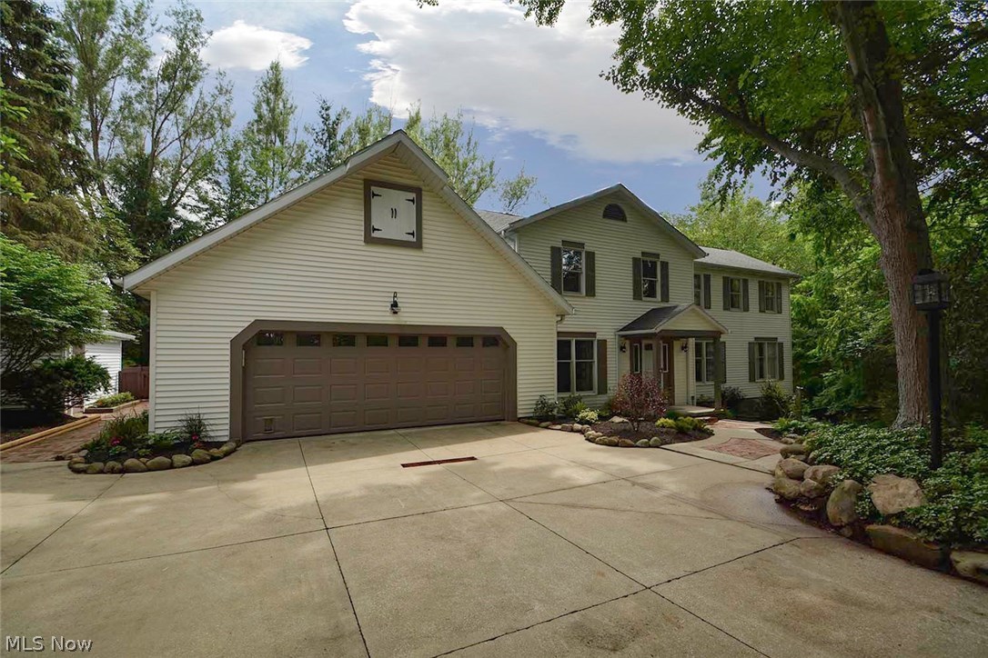 Drive into the woods in Lake of the Woods Development to view this unique completely renovated  home in Copley-Fairlawn Schools. The beautiful first master plan with a two story great room overlooking a wonderful yard with loads of  windows and skylights provides views of the woods and a pool and loads of natural light. This home is located on a cul-de-sac with a spacious driveway and garage to greet you. As you walk in the front door the foyer welcomes you with new hardwood floors through out the first floor. Entertaining will be easy in the open kitchen, formal dining room, sunroom,  family room, great room, that all lead out to three decks, a swimming pool, and covered backyard patio. Other first floor features include a floor to ceiling fireplace, vaulted ceilings, mudroom/laundry room, guest bathroom, and the master suite with a large walk in closet. The second  floor boasts three nice sized bedrooms, a large bathroom, 7 x 5 hall closet. The basement was a new family room and bar, the unfinished part of the basement is 80 x 13, and the basement walks out to to the backyard. The kitchen and bathrooms are completely new in every way with new granite, new flooring, new fixtures, new stainless steel appliances, new vanities, and new lights.