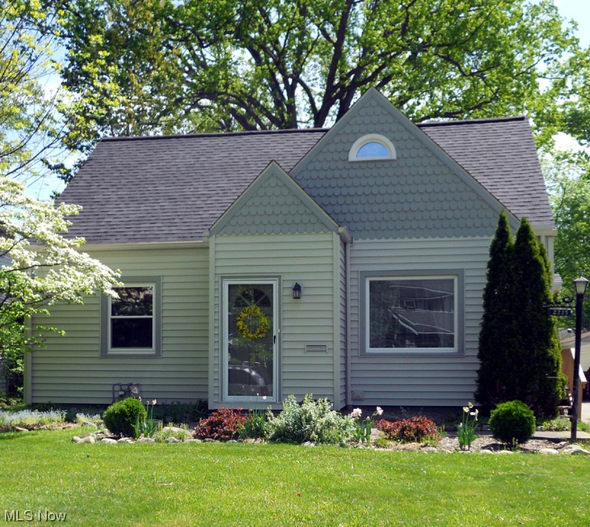 This cozy Cape Cod home located in the desirable North Haven neighborhood of Cuyahoga Falls, Ohio features lots of hardwood flrs, 3 bedrms, 2 full baths & a recreation room in LL of this smartly finished home. The Living rm is bright light & has beautiful hard wood flrs. The eat in kitchen features 42 in. Kemper cabinets & draws w/ soft close feature, Quartz counter tops, new stainless steel appliances & a ceramic flr. There are 2 nicely sized bedrms & a full bath on the 1st floor. The owner’s suite on 2nd floor is 31 feet long with hardwood flrs, has a very large walk in closet & a sitting room. The LL has a beautifully finished recreation rm w/ a full bathrm. The spacious wooden deck provides a great area for outdoor enjoyment while overlooking the park like backyard.  There is a detached 1+ car garage. Updates include roof, furnace, finished basement remodeled kitchen, replacement windows, vinyl siding $73K in updates. Please see the update list in the MLS. This home is as move in r