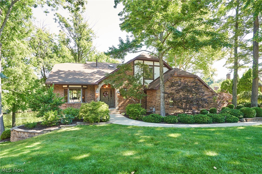 Welcome to this staycation lake front property nestled in the heart of Fairlawn Ohio. Here you will find a true retreat, a nature’s lovers paradise with waterfowl including swans, ducks, and geese as well as a perfect setting for bird watching.  The outdoor spaces include double level decks with fireplaces on each level, a paved lakeside patio, a boardwalk with custom wrought iron railings which allows excellent fishing and a paved feeding station for wildlife.  The Lakeside Lounge includes built in cabinetry for all deck furniture, a  wooden ceiling with recessed lighting and fans.  The Treetop Winery with custom fireplace, a 20’ pergola with retractable awnings over the grill area and together can accommodate 50 people. At the end of the driveway is a Cornerstone patio with a padded glider that overlooks the deck and lake.  This unique property offers much more than what you see inside. It encompasses a lifestyle of serenity in a natural setting which few properties can rival with its convenient location to all amenities. Your Discovery Channel experience awaits!