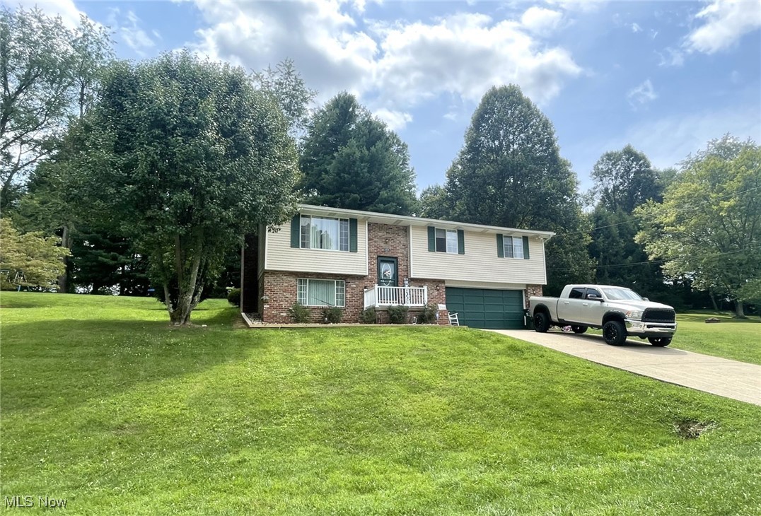 Remarks:  4 bedrooms, 1 1/2 baths, and updated new deck with hot tub! Remodeled kitchen with painted cabinets, new hinges and handles Also new light fixtures. All new landscaping with 6x6 treated borders, oversized rock, and beautiful bushes. Move-in ready.