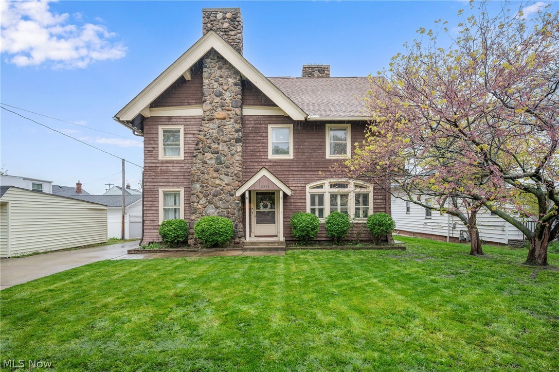 This 4,400-square-foot legacy residence on Elbur Lane offers a rare combination of early 20th-century character and 1950s structural modernization. Originally part of the Bailey orchard and relocated from Detroit Road in 1956, the home sits on a solid mid-century foundation, providing a unique structural advantage for the area. The interior showcases grand architectural details, including an exquisite oak-paneled study with original leaded glass windows, a dramatic two-story rear foyer with a stately banister, and five beautifully crafted fireplaces.
The property maintains a legal two-family classification while functioning seamlessly as a cohesive single-family estate. Modern living is prioritized with a beautifully renovated kitchen featuring high-end appliances, complemented by a relocated second-floor laundry for added convenience. Recent mechanical updates include a new furnace, new hot water heater, and updated electrical.
Currently configured as a 3-bedroom, 3-bathroom home, the layout offers exceptional expansion potential. The 900-square-foot finished third floor serves as a versatile blank slate, while the second-floor kitchen could easily be converted into a spacious fourth bedroom. Alternatively, the dual-kitchen configuration creates an ideal setup for multigenerational living, a private guest suite, or a high-end “house hack” investment opportunity.
Complete with a renovated primary bath and original hardwood floors throughout, this residence is fully functional today while offering the opportunity for its next owner to bring their own design vision to the remaining original spaces. This is a rare opportunity to own a truly distinctive property on a quiet cul-de-sac in Lakewood. Don’t miss this once-in-a-lifetime home.