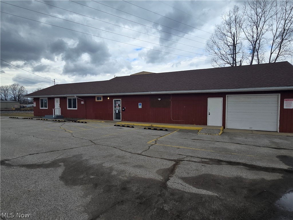 High-traffic location in a prime commercial corridor. Property was the longtime home of Dempsey's Appliance for over 50 years, demonstrating strong visibility and proven commercial use. The building offers over 3,300 square feet and has received extensive updates by the current owners.

Updates include completely updated electric and plumbing systems, brought up to current code, along with new commercial carpeting throughout, new drywall walls, and new ceilings. The interior features approximately six offices, a retail/showroom area, receiving bay, kitchen area, finished living space, and a large warehouse/storage area. Two half baths and an exterior storage shed are also included.

The property is suitable for a wide range of uses including professional offices, automotive-related businesses, retail storefront, light manufacturing, warehouse, wholesale operations, call center, and more. Ample off-street parking available.