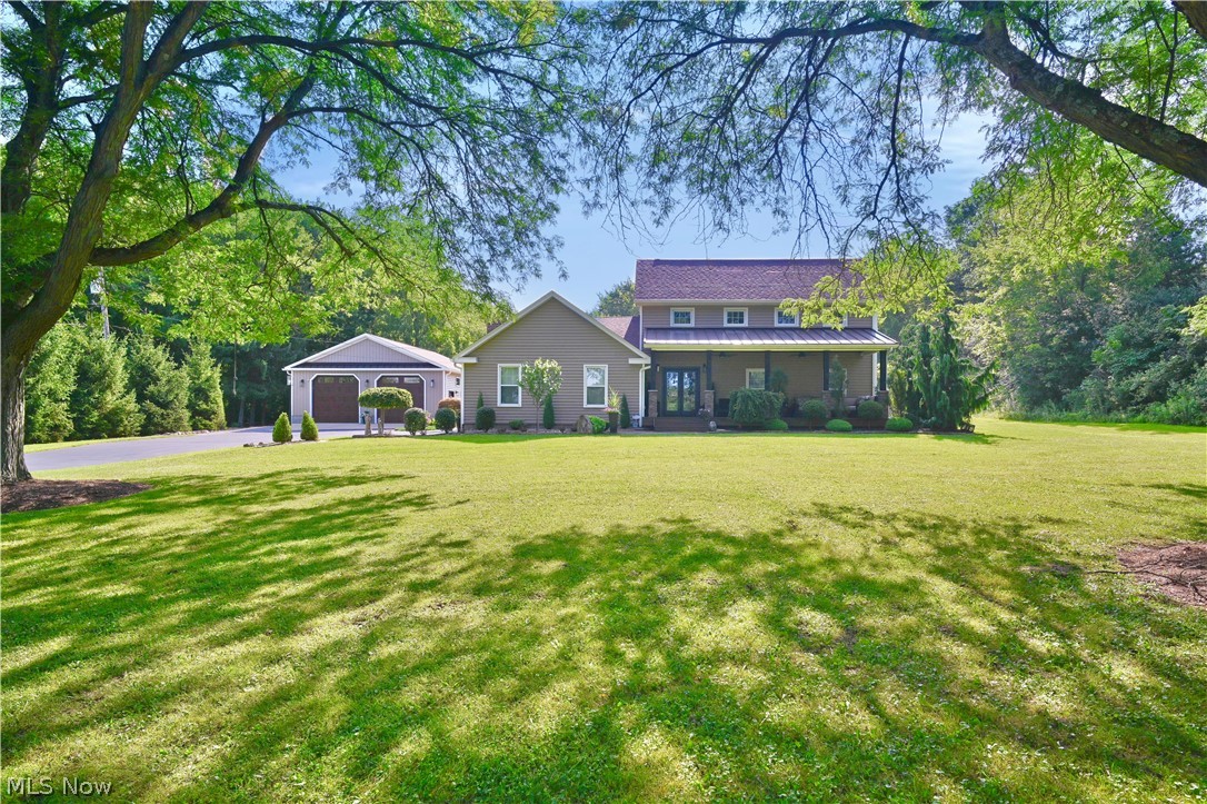 Welcome to your own private retreat in Canfield! Nestled on 3.86 scenic acres, this spacious 4-bedroom, 2.5-bath colonial offers over 3,100 square feet of comfortable living space with room to spread out both inside and out.
The thoughtfully designed floor plan features generous living and entertaining areas, four spacious bedrooms, two and a half baths and plenty of natural light throughout. Step outside and enjoy the peaceful setting with nearly four acres of open space, perfect for recreation, gardening, or simply taking in the country views. A few standout features of this property are the inground pool, breathtaking sunsets from the huge front porch, impressive 32' x 40' outbuilding, providing endless possibilities for hobby space, equipment storage, or additional garage space. Whether you're looking for room for vehicles, or toys, this versatile building is ready to meet your needs. There is an additional 24x40 building with a workshop. 
Offering the perfect balance of privacy and convenience, this property is just minutes from Canfield schools, shopping, dining, and major routes. If you've been searching for space, functionality, and a beautiful country setting, this is one you won't want to miss. Too many updates and features to list. Call for details and to set up a time to view this stunning home.