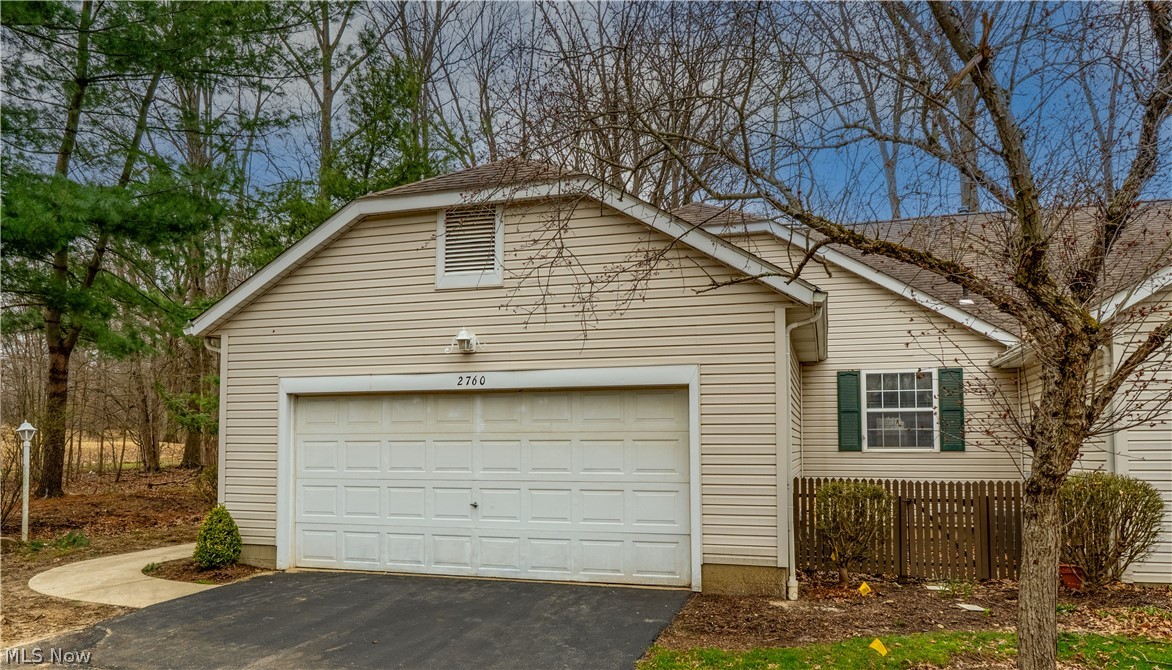 Welcome to 2760 Stockman Ct at popular Woodbury. This RANCH condo is located on a private cul-de-sac with additional parking just steps away. This condo offers one floor living - the front door opens into a foyer entry that flows into the great room with a vaulted ceiling, window seat, and a gas fireplace. The great room is open to a formal dining area with bayed windows, and a trayed ceiling. There is a door that leads to steps and the backyard. The fully applianced kitchen has ceramic tile floors, and a large breakfast bar. On the main floor, there are two large bedrooms, and two full baths, as well as a first floor laundry room that includes the washer and dryer, cabinets for storage, a wash tub, and a closet for additional storage (or pantry). The master bedroom has a vaulted ceiling and a cozy sitting area, a closet and an ensuite bathroom that includes a walk-in closet & a tub/shower. On the lower level you will find a huge family room, an office area, and another bedroom with a large walk-in closet and a full bath. In addition there is a large storage area and a workshop area with a work bench and wall speakers that remain. There is a built-in whole house vac, and updates include a newer hot water tank (2025), dishwasher (2024), and the Kenmore washer (2024). The furnace was installed in 2019. There is new carpet in the family room and the office area on the lower level. Two windows are damaged (one in the great room, and the other in the 2nd bedroom). The seller has contracted for both of those to be replaced as soon as possible. (They were measured and have been ordered). With a recent price reduction, this condo is priced to sell! Call for your appointment today!