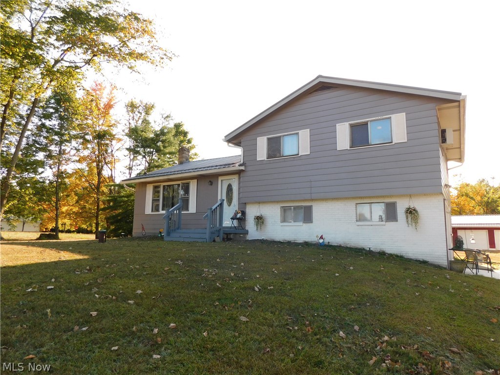 Spacious split level with lots of storage, hardwood floors, multilevel living space. Large barn pole building with 2nd floor 24x40, detached garage 24x32, shed 16x12. House and buildings have metal roofs. Large 4.2 acre lot. Property to include new updated septic system.