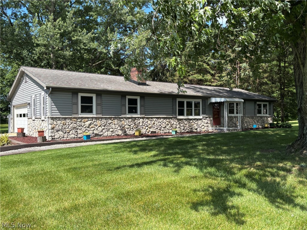 Welcome to 1961 Killian Road, where comfort, space, and thoughtful updates come together on a beautiful, 1.5-acre lot. Lovingly maintained by a long-time owner, this inviting 4 bedroom, one-and-a-half-bath ranch offers the right blend of country charm and modern convenience.

Step inside to discover a spacious living room highlighted by a cozy fireplace, creating a warm and welcoming gathering space for family and friends. The home also features a versatile, first-floor den/study, ideal for a home office, reading room, or quiet retreat.

The eat-in country kitchen showcases hardwood flooring and offers picturesque views of the expansive rear yard, making every meal a little more enjoyable. Off the kitchen, a deck provides the perfect spot for morning coffee, outdoor dining, or simply taking in the beauty of the surrounding landscape.

The bedrooms offer comfortable living, and hardwood floors are believed to be located beneath the carpeting in 3 of the bedrooms and living room, providing exciting possibilities for future enhancement. 

Outside, the attractive combination of vinyl siding and stone accents creates exceptional curb appeal, while the level, 1.5-acre lot offers endless opportunities for gardening, recreation, entertaining, or simply enjoying the peace and privacy of your own outdoor oasis. An attached, two-car garage adds practicality and convenience.

The full basement offers additional living space with a  24' x 20' recreation room, perfect for game nights, hobbies, or additional entertaining space. The unfinished portion provides abundant storage and workshop areas to accommodate a variety of needs. Many updates and numerous improvements have been made throughout the years, with a detailed update list available upon request.

If you're looking for a move-in-ready home with room to grow, beautiful outdoor space, and the confidence that comes from years of dedicated ownership and care, 1961 Killian Road is a property you won't want to miss.