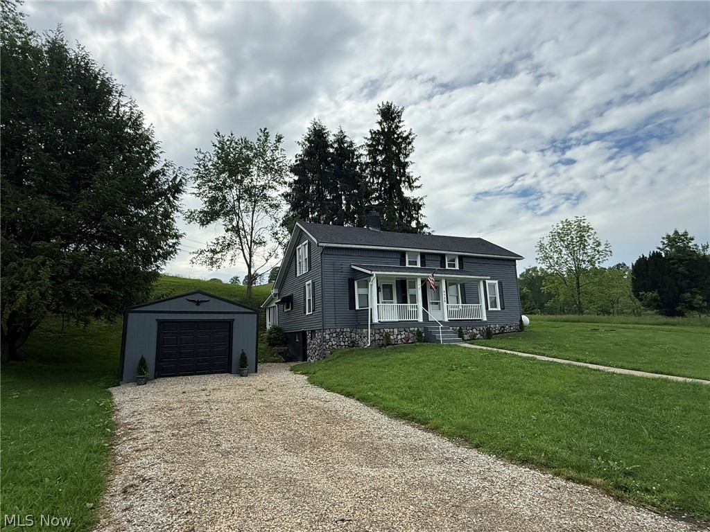 Peaceful country setting with 1.5+/- acres. Remodeled 5 bedroom, 2 bath farmhouse. Fresh paint with wood laminate flooring throughout the main level. Spacious living room. New white kitchen cabinetry with marble counters opens to the formal dining room. Main floor bathrooms feature clawfoot tub and marble counters & the second main floor bath offers a walk in shower and marble counters. Main floor laundry room off the mud room. Spacious main floor master bedroom. Large family room on the second floor with decorative fireplace. 4 bedrooms also located on the 2nd floor. 24 X 11 screened in porch leads to the covered patio and firepit. Beautiful country setting with scenic views. Additional updates include new drywall and light fixtures throughout, new pecks plumbing, new 200 amp electric, 2 new furnaces and 2 air conditioners, new roof and more. Exclude 2 electric fireplaces. Room sizes are estimates.