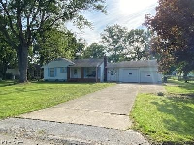 Great location, quiet street, approximately one hour from Cleveland and Pittsburgh. Easy one floor living. 3 Bedroom ranch. 1 full bath upstairs, 1 full bath downstairs in full, finished, walkout basement. Fireplace in lower level. Nice sized rooms with hardwood floors. Breezeway and 2 car attached garage with additional storage leading to large, private back yard. New hot water tank and freshly painted.