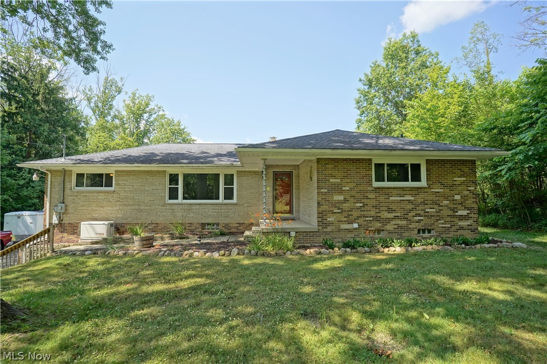 Do you need a separate "in-law suite" or full apartment?  Do you want privacy and a few acres?  If so, you have just come to the right house! Click the link above that will take you to a 3D virtual tour of the home.  This lovely ranch offers 3 bedrooms upstairs (owners suite has a half bath), and an additional bedroom and living space with a kitchen off the garage on the lower level.  There is a fireplace in the eat in kitchen. An office off the kitchen keeps the new "work from home" people quiet away from the rest of the house, yet close enough to multi-task.  How about the bonus that the house gets free gas since there is a gas well on the property?  It also feeds a natural gas home generator that comes with the home!  The current owner made many repairs and changes to the home since they bought it. Here is your opportunity to get county living, yet stay close to everything.