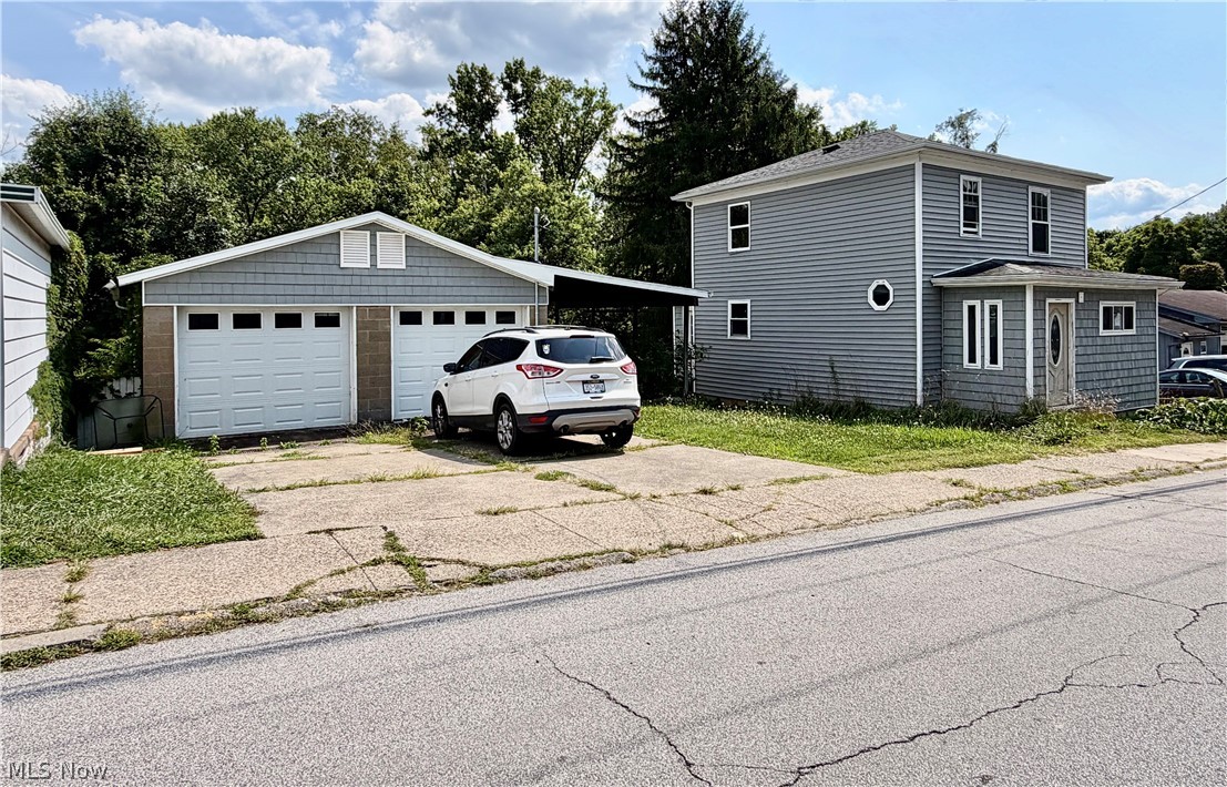 Did you hear that? That's opportunity knocking, and you'd better answer. Calling all investors, flippers, and visionaries, this is your chance to turn potential into profit. Completely gutted and ready for its next chapter, this property offers the perfect blank canvas without many of the costly exterior improvements standing in your way. The heavy lifting has already been started including the siding, replacement windows, electrical service, and a solid roof already in place. Now it's time to roll up your sleeves, bring your imagination, and create something incredible. Situated on two parcels, you'll also find a detached two-car garage, attached carport, and a generously sized backyard. The real bonus? The garage includes a patio area and workshop space that could potentially be converted into an additional rental unit or living space giving buyers the opportunity to maximize their return. See it soon or be sorry. Property is being sold AS IS.