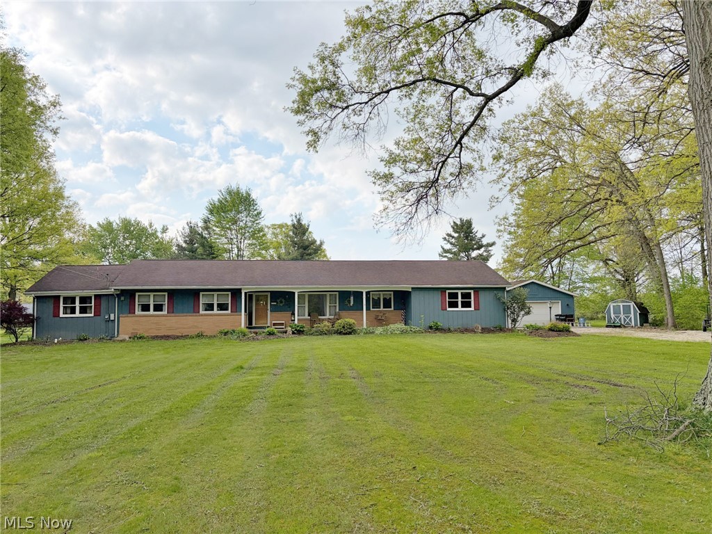 Fixer-Upper Ranch Home with Attached Garage Plus 22 X 24 Detached Shop, 2.77 Acres. Smith Twp., Mahoning Co., West Branch Schools. Dead-End Road. Live Onsite Auction. Family-owned for 50 years. Absolute auction, all sells to the highest bidders on location: MONDAY, JUNE 15, 2026, 5:00 PM - REAL ESTATE SELLS AT 5:30 PM. Sprawling ranch home built in 1970 with applianced galley kitchen with dining area, a formal dining room, front living room with picture window, den with fireplace and hardwood floors with access to a rear patio, three bedrooms all with hardwood floors, one with private half bath, plus one full bath, additional half bath, fourth bedroom/bonus room addition, front foyer entrance with guest closet. Mudroom off attached two-car garage with access to full basement under main home, crawl space under addition. Breaker electric, modern FA furnace, central air, laundry area with washer and dryer, and sump pump. The home has structural and foundation issues. Rear sunroom, covered front porch, 22 X 24 finished detached garage, small storage barn. 2.77 acres total, with an extra stately, treed lot on a dead-end road.
