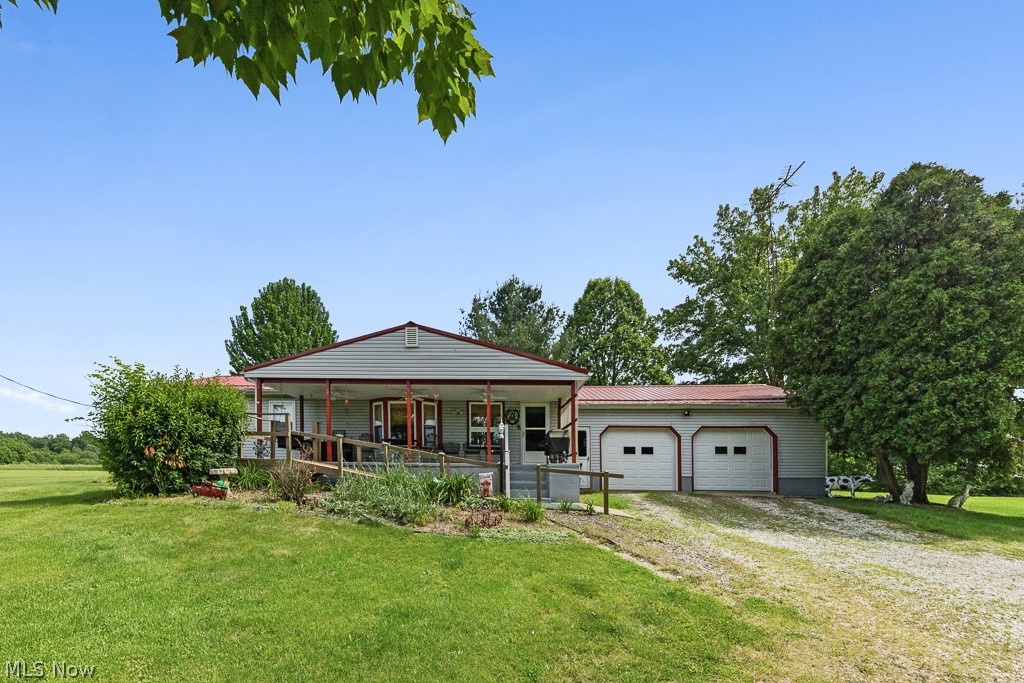 Here is the opportunity you have been waiting for! A beautiful ranch situated on 6.74 acres of gorgeous land. This home has so much to offer inside and out, and it is ready for its next owner. When you first arrive the large front porch will greet you, perfect for your morning coffee. Inside the spacious living room offers plenty of space as well as new carpet and paint. The bedrooms all have matching updated carpet as well. As you make your way into the dining area you are met with the open flow straight into the kitchen. Right off the kitchen you have access to the sun room that overlooks the wooded backyard. The full basement offers bonus storage space as well as an additional finished room for recreational use. Outside you get to take in all that the 6.74 acres has to offer. The property has a large 36'x24' dirt floor barn, perfect for storing equipment or working on your projects. The attached two car garage offers additional room for parking and storage. Don't hesitate, get your private showing scheduled to see if this could be a fit for you!