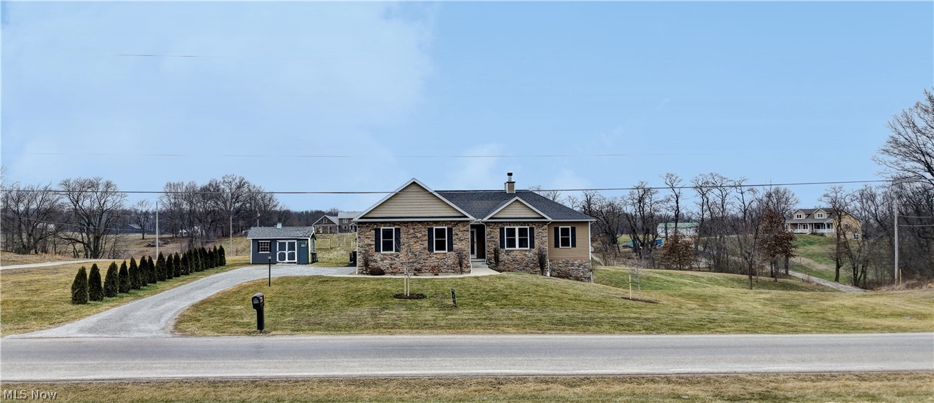 This gorgeous four-bedroom ranch sits on over 1.5 acres in a tranquil rural setting, with easy access to Route 30 and breathtaking views. Located in the Dalton school district, this home combines privacy with exceptional everyday livability. Inside, you’ll find a thoughtfully designed split-bedroom plan that maximizes comfort and privacy. The kitchen shines with granite countertops and solid wood doors throughout. The great room features cathedral ceilings and a cozy wood-burning fireplace, while nine-foot ceilings flow throughout, including the finished walk-out basement. The expansive, partially finished basement adds over 1,200 square feet of flexible living space, plus another full bath—ideal for a recreation room, home theater, or guest suite. Outside, enjoy ample room for outdoor activities, gardening, or simply sitting on the back deck under your pergula enjoying the scenic surroundings. The property also includes some upgraded landscaping and trees, a 10x14 storage barn and the home is wired for a generator and has battery back up. Schedule your private showing today.