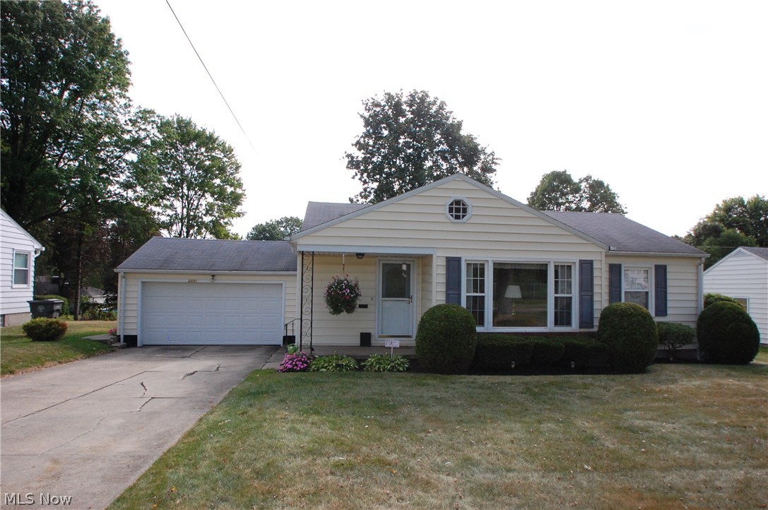Super neat and clean 3 bedroom ranch home ready for new homeowner. This home features a living room with fireplace and  gas logs, formal dining room, equipped kitchen with vinyl floor and off the back of kitchen is a 15x12 enclosed back patio. The basement is finished with all knotty pine paneling and tile floor with a full bath and all glass block windows plus laundry area with washer & dryer staying. Some recent updates include vinyl windows, HWT and all downspout lines cleared to the street. This home also has a 2 car attached garage and a security system.