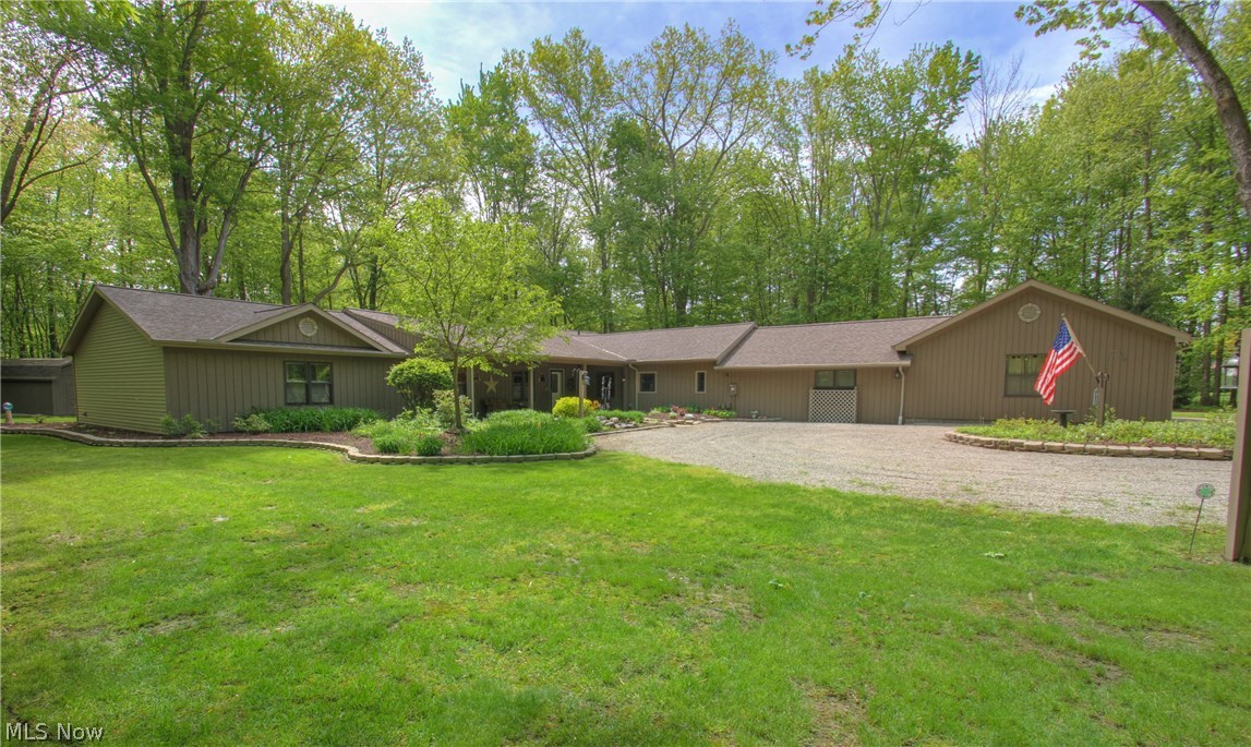 Incredible 3000+ SF sprawling ranch situated on park like 2.13 acres setting. Remodeled gourmet eat in kitchen with stainless steel appliances, maple cabinets, ceramic tile floors, under cabinet lighting and nice walk in pantry. Huge 28 x 22 master suite addition with nice sitting room with vaulted ceilings with master bath with ceramic floors, corian countertops plumbed for 2nd sink and skylight and huge 15' walk in closet. Master walk out Pella slider leading to brick patio and private backyard. Large living room with built in bookshelves and French doors to office and remodeled 2nd full bath. 2nd master/guest suite with private bath and his/her walk in closet. Formal dining room with ceramic tile floors and has French glass doors that leads to sunken sun room that walks out to beautiful paver patio with electric awning. Additional living suite off 3 car garage with 1/2 bath and kitchenette. Great for recreation room, possible in law suite or private home business. Sprinkler system,