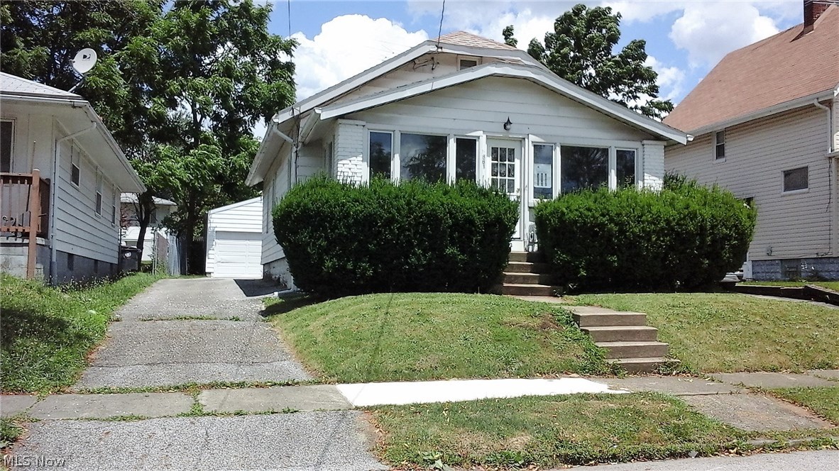 Move in ready brick & aluminum bungalow home, waiting for you! Has a private entrance for your own suite, or can be a family room, etc.  Many choices! Has a walk in tub in master bath with wide doorway. Newer Anderson windows with screens. Lovely sun porch lets in great light! Upstairs is a finished space just waiting for your imagination!  Cedar closet in one of the bedrooms.  Great basement storage also!  Water heater & furnace were new in 2013. Vented glass block windows in the basement.  The washer & dryer stay!  All this and a home warranty too!  Motivated seller and the price is right!  Come see your next home!