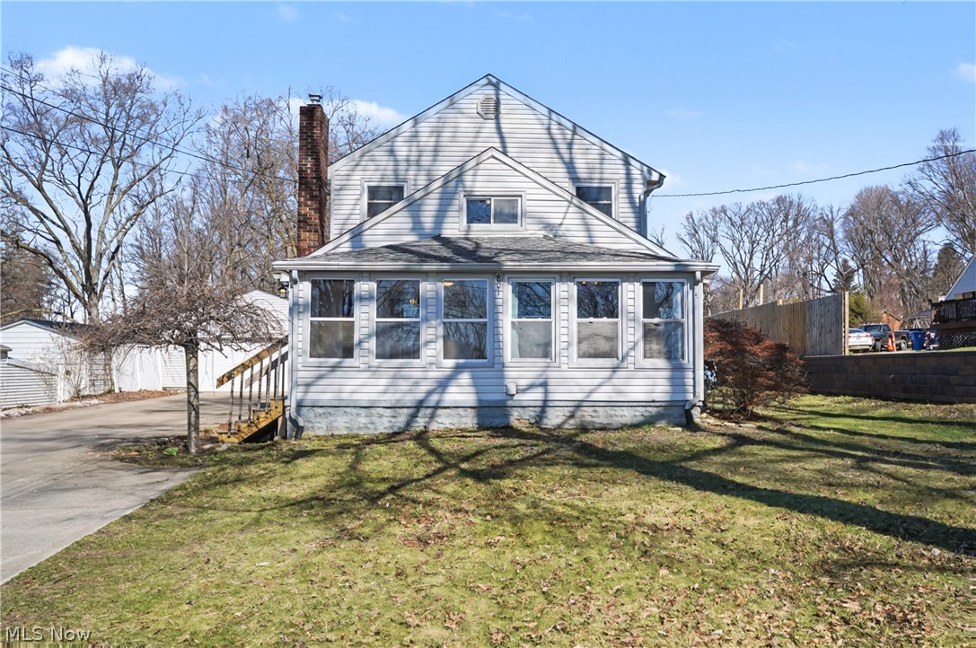Welcome home to this modern colonial style home located in Coventry School District. As you make your way inside, you will be in a three seasons room that opens to one of the three spacious living rooms. Off the right if this living room is a great sized laundry room on the main level to make everything more convenient. As you seamless move from this family room into the open eat in kitchen and dining room that connects to the second family room with a full bath to the side. Downstairs features an additional finished living room to entertain or to just wind down and relax. Upstairs features three bedrooms alongside a spacious second full bath. Outside, the partially fenced in back yard also features a spacious plenty of yard space with almost an acre  and to the two plus car garage with drive through access with a bonus garage door on the rear of the garage. This home is move in ready and just needs you to make it yours. Call to schedule your private showing today !