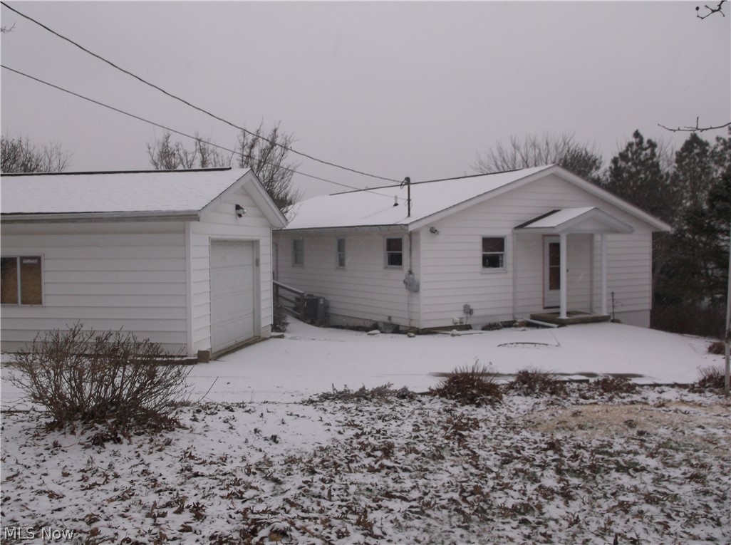 Great home in West Muskingum School Dist. Home is in excellent condition. Finished family room in basement could be 3rd bedroom or man cave. Home has electric baseboard heat in every room for backup to heat pump. New in "2016"- Roof over front door, master bath completely updated. "2017"- New floor and toilet in lower bath, hot water tank, drain installed from top of drive to woods in back plus retaining wall. "2018"- Main water line from meter to house, entry door and new opener on detached garage, Carpet in master bedroom, front storm door, ceiling fan in spare bedroom, new gravel. Lots of road frontage. Walkout door in basement. 2 car basement garage and 1 car detached garage. 5 person hot tub stays. Had new distribution pump installed, control panel, spare filters, new pillows and cover 3 years ago. Had professionally closed by AAA Pools 3 years ago so all new parts are still like new. The sale for $25,000 in "2016" was for 8 acres only, not for the house and the rest of the proper