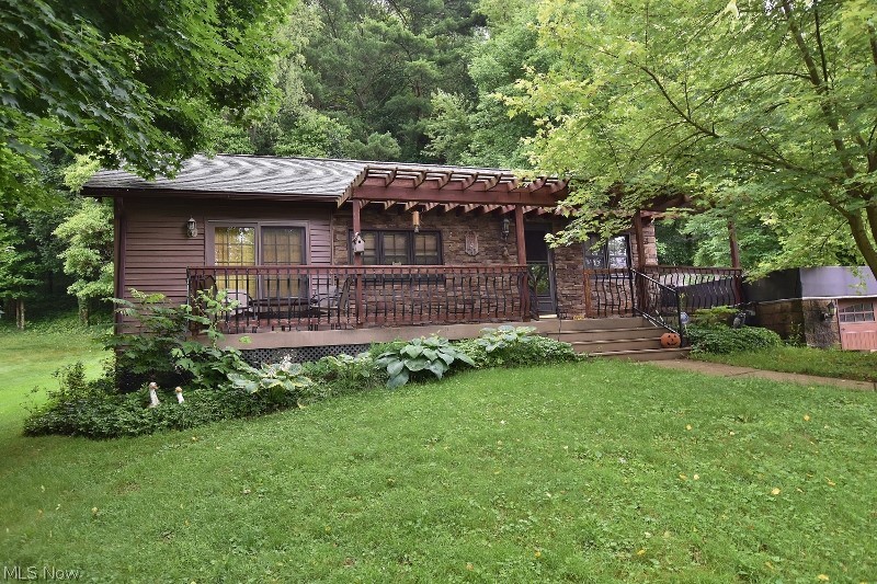 Charming lake view cottage in the popular Atwood Glens community provides a great opportunity to start enjoying lake living at beautiful 1540 acre Atwood Lake.The charm of the original cottage has been preserved with the addition of more modern areas blended in. The original cottage area is an open format with open beamed cathedral ceilings & timeless tongue and groove knotty pine. The owners recently added a stunning living room with a gas fireplace, vaulted ceilings & patio doors leading to the lake view deck. Another addition is a eat in kitchen providing more counter space, additional cabinets & a second stove. Of course, within a short walk from the cottage is your very own private dock for your boats and provides an incredible location for enjoying the stunning Atwood Lake Sunsets. The cottage features 2 main floor bedrooms & a small upper bedroom which the kids will love as well as a open loft area for an additional sleeping area or storage. The home features a spacious front la