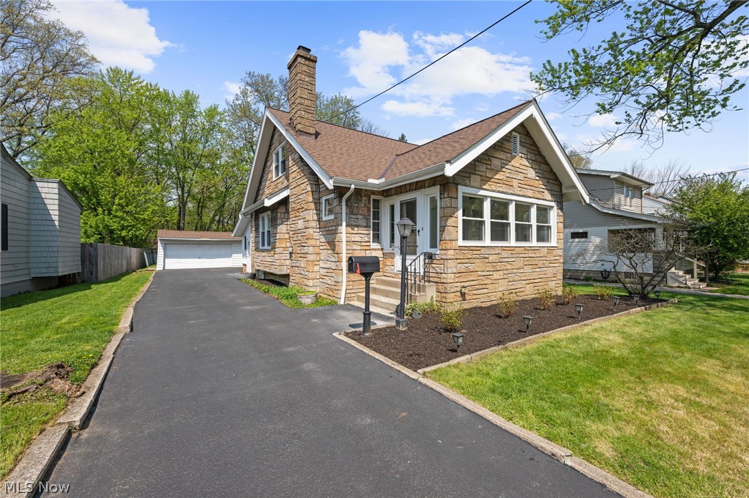 Looking for your dream home? This stunning, fully remodeled 4-bedroom home is the perfect blend of timeless character and thoughtful modern updates. Original woodwork and rich hardwood floors flow throughout, beautifully preserving the home’s charm while complementing the stylish renovation. A welcoming covered front porch invites you inside to a spacious living room filled with natural light from a large window, anchored by a decorative fireplace and classic built-in cabinetry. The dining room is equally impressive, featuring a seamless mix of original and updated built-ins along with a charming window bench, creating a warm and inviting space for gatherings. The kitchen is truly breathtaking, showcasing crisp white cabinetry, light countertops, a beautifully detailed ceramic tile backsplash, and stainless steel appliances, all included. Just off the kitchen, a cozy sunroom offers the perfect spot to enjoy your morning coffee, with direct access to the backyard. The main level offers the ease of first-floor living, featuring two generously sized bedrooms and a beautifully updated full bathroom. Thoughtfully designed, the bath includes a stylish vanity with storage, a tub/shower combination with ceramic tile, and decorative open shelving, creating a space that feels both functional and inviting. Upstairs, the owner’s suite provides a peaceful retreat with a lofted ceiling and ample closet space. An additional spacious bedroom and a second full bathroom complete the upper level, featuring a walk-in tiled shower and elegant finishes that create a true spa-inspired escape. The unfinished lower level offers endless possibilities, ideal for future living space, a home gym. Step outside to enjoy the partially fenced backyard, perfect for entertaining, relaxing, or gardening, along with a detached two-car garage for added convenience. All that’s left to do is turn the key and make this home your own. A one-year Home Warranty is included. Home will be violation-free.