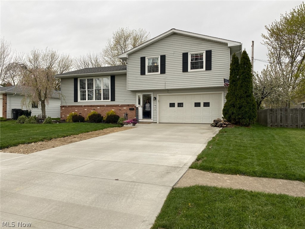 Beautifully updated split level, new windows throughout, newer flooring, sliding doors from dining lead to the two tiered deck.  Also a covered patio off the garage. spacious fenced in yard with fire pit area great for entertaining. All appliances in the kitchen stay with the home.  Brand new driveway and porch.