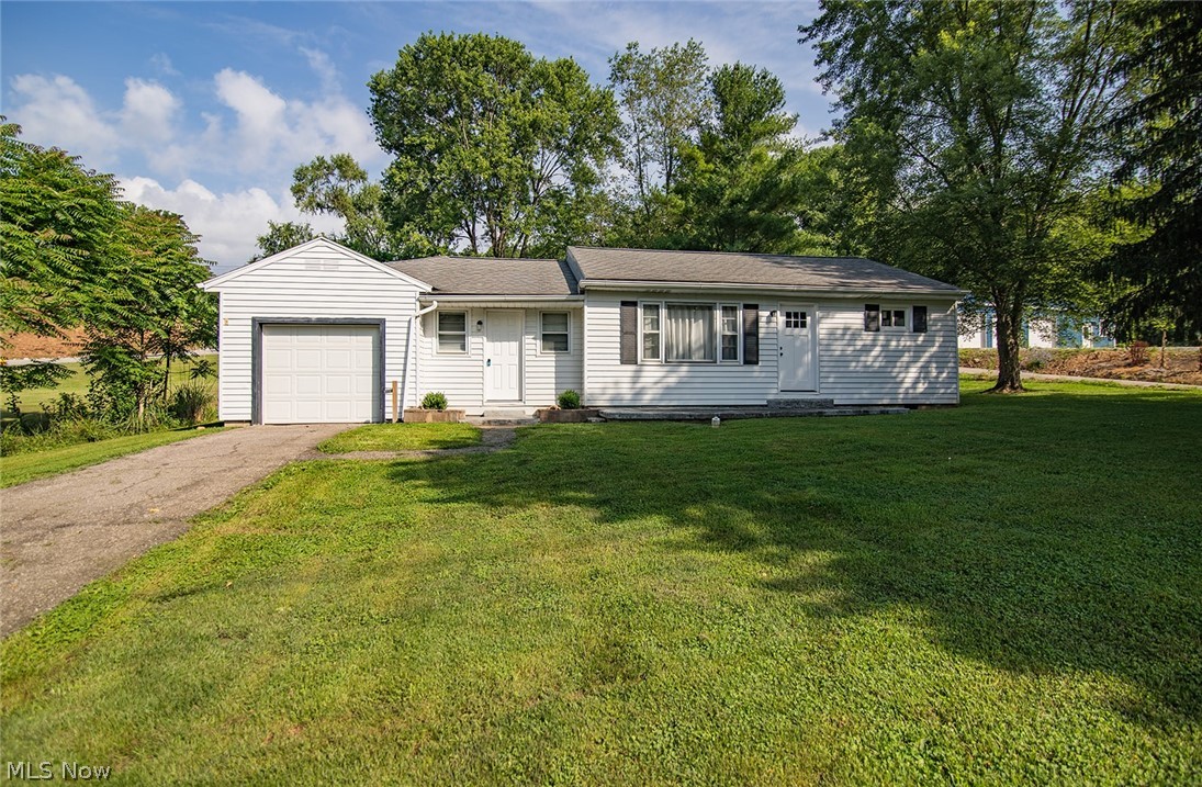 Cute as can be! This charming, updated 3 bedroom home offers the perfect blend of modern updates and peaceful country living, all while being just minutes from shopping, dining, schools, and everyday conveniences. Inside, you will find a beautifully remodeled bathroom, an updated kitchen featuring new cabinetry, new countertops, select stainless steel appliances, and white trim and doors throughout. Hardwood floors add warmth and character, creating a welcoming feel from the moment you step inside. Outside, a single-stall garage provides added convenience, and the country setting offers a peaceful country setting. Make your appointment today to view this little charmer today!