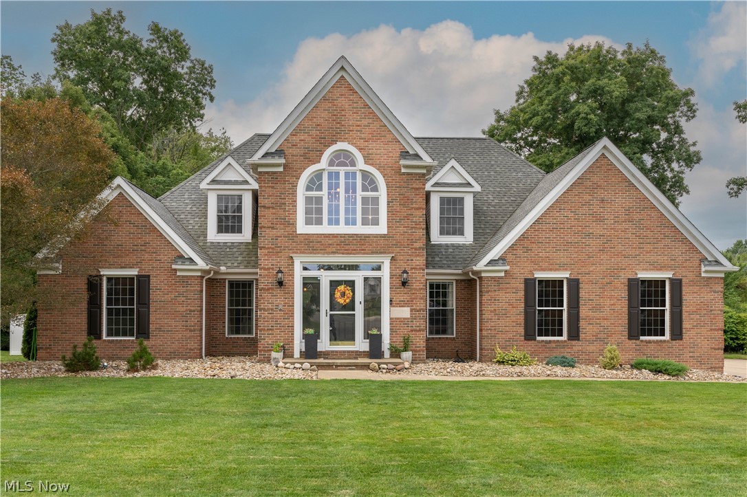 This custom built quality home offers an appealing open floor plan, in Lake Schools with all the space you want.  This breathtaking home will impress you from the moment you step into the stunning 2 story great room with 2 way 2 story fireplace.  Custom designed sunroom full of windows, circular Cathedral ceiling will become your retreat with its scenic backyard view.  Quality apparent throughout with the dental tooth finishes in the crown molding, solid wood doors, windows trims. TWO first floor master suites: both Master suites have private full bath & abundant closet space: great in-law suite.  Kitchen has double ovens, stainless steel appliances & center island with breakfast bar... open & inviting for everyday life or entertaining! 1st floor Office with built in cabinets & desk.  Second floor features 3 additional bedrooms, one is a JR suite with full bath, walk in closet & the "Secret Room" sure to excite the young ones.  2nd full bath on this level too.   3 car side load garage.