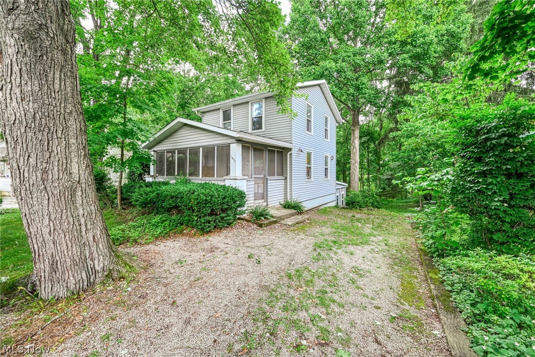 Welcome to your own private slice of paradise tucked away in the serene nature of Twin Lakes.  If you've been dreaming of a lifestyle where "lake life" isn't just a weekend getaway but a daily reality, this charming bungalow is calling your name! Rest easy knowing all the heavy lifting has already been done for you. New Roof and Gutters (2025), New Furnace (2025), Ohio State Waterproofed Basement (2025), and the updated vinyl siding for a crisp low-maintenance curb appeal. The screened front porch will be your new favorite spot for morning coffee, evening reading, or listening to the rain without the bugs. It's the perfect extension to your living space. Adventure ready storage located just outside the walkout basement for housing kayaks, paddleboards and fishing gear. The nature filled backyard is an oasis surrounded by greenery. Includes a large shed perfect for lawn care tools or a dedicated hobby workshop. You are just a short walk around the curve from the water's edge, boat access, beach and fun with a private community beach and pavilion. Don't just buy a home, buy a lifestyle! All the big ticket costs are done, come have fun making your dreams a reality in cosmetic updates in paint and refinishing the beautiful hardwood flooring throughout the home in this adorable bungalow. Your new home or your getaway is waiting!!!