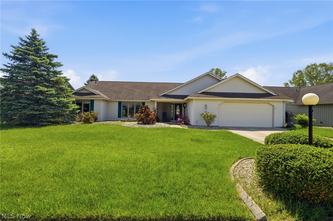 Thoughtfully designed one-level slab ranch that lives large and feels instantly welcoming. Enter into a foyer that opens to a spacious great rm anchored by a brick-front, wood-burning fireplace for cooler nights. Huge eat-in kitchen with island, pantry & ample cupboard space offers a clear view into the great rm—ideal for everyday living & entertaining. Bright morning rm overlooks a lush, grassy common area. Sliding doors lead to the back patio with pergola (2015)—a cozy outdoor retreat for relaxing, dining or enjoying the peaceful, open green space. Pocket doors open from the great rm into an impressively large formal dining rm. The private primary suite features its own bath with shower, separate jetted tub, dual vanity & walk-in closet. Two additional bedrooms & a full bath on the opposite side provide flexibility for guests, family or home office. Handicap-accessible features add ease & versatility. Spacious laundry rm off the oversized 2-car garage with pull-down attic & updated springs (2018). Updates include: microwave (2022), stove & dishwasher (2021), disposal (2025) & outdoor lighting (2024). Roof & mechanicals are original, reflecting long-term ownership and care. While the décor may be ready for your personal touch, the floor plan & features are exceptional. Enjoy community amenities including clubhouse, Olympic-length pool, fitness facilities, sidewalks & social activities. Conveniently located near I-480, shopping & dining. This home blends an exceptional floor plan, one-level living & neighborhood amenities—ready for your updates, your style & your next chapter.