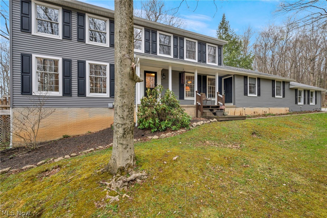 Tucked away at the end of a quiet cul-de-sac, this exceptional 5.3-acre private retreat offers a rare combination of space, privacy, and natural beauty in the heart of Claridon Township.  Surrounded by mature trees and highlighted by a picturesque spring-fed pond, this property delivers a lifestyle that feels like a getaway every day. From the inviting front porch to the expansive outdoor spaces, every detail of this home is designed to embrace both relaxation and entertaining. Inside, you'll find a thoughtfully designed layout featuring a spacious main-level owner's suite with a full bath, offering convenience and privacy, along with a total of 3 full bathrooms and an additional half bath to accommodate family and guests. The heart of the home is the beautifully updated kitchen featuring granite countertops, abundant cabinet space and appliances, along with direct access to a walkout deck, perfect for enjoying morning coffee or evening views of the surrounding landscape and pond. Multiple living spaces provide flexibility and comfort, including a cozy family room with a fireplace and a separate living room offering generous space for gatherings. The 3-car garage provides ample storage and functionality, while the expansive 5.3 acres offer endless possibilities for outdoor enjoyment, recreation, and entertaining. Whether you're relaxing on the deck, enjoying the peaceful pond, or taking in the quiet surroundings, this property offers a rare opportunity to own a private estate while still being conveniently located near Chardon's and Burton's amenities. Homes offering this combination of acreage, privacy, and move-in-ready condition are truly limited, making this an exceptional opportunity for buyers seeking space, nature, and lifestyle all in one.