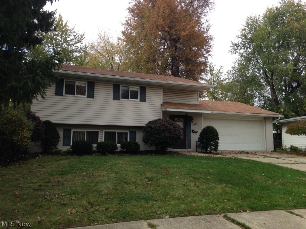 Welcome home to this unique 4 bedroom BiLevel home that has the feeling of a spacious colonial.  You will enjoy the updated, eat in kitchen that opens to the large family room. A large mudroom with laundry and half bath/utility room finish off this lower level.  Off the back you can appreciate the private fenced back yard from your 3 season room with its own heat source for the chillier evenings! Upstairs you will find hardwood floors throughout the nicely sized bedrooms with ample closet space and a full bathroom.  The master bedroom even has its own half bath.   This home is priced to sell! Dont miss it!