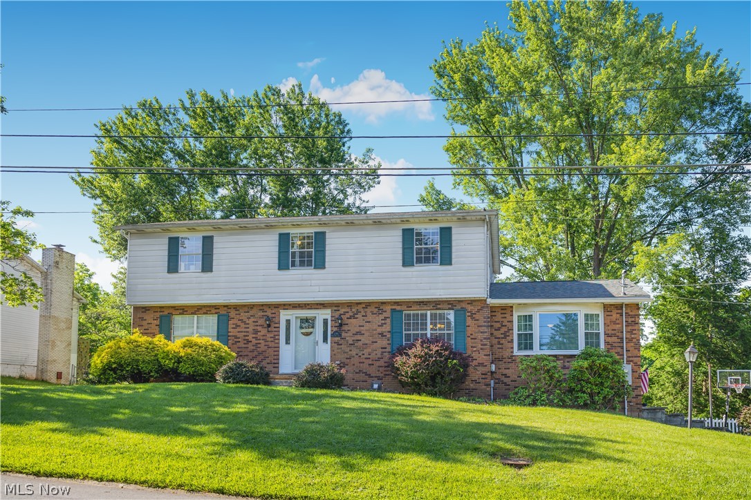 You want to know something that is HARD to find? A home with 4 bedrooms, 3.5 bathrooms, 2 living areas, bonus space in the basement, 2 car garage, beautiful kitchen, formal dining room AND located in the best neighborhood Wood County has to offer…you're in luck, 246 N. Hills Drive is available for purchase.
The family room pulls you in with its exposed wood beam ceilings and fireplace, and the kitchen is bright and updated with white cabinets and stainless steel appliances. The formal dining room with hardwood floors and chandelier is ready for the moments worth celebrating, the breakfast nook is perfect for slow mornings. 
Upstairs, four bedrooms and two full baths give everyone their own space to land at the end of the day. The finished basement gives you room to dream…playroom, home office, guest suite, man cave…whatever your family needs it to be, with a full bath and sliding door access to the backyard. And the neighborhood? North Hills is the real deal. Summer days at the community pool, fishing at the pond, kids on the playground, evening pickleball matches with the neighbors…and the Fourth of July community parade is a must attend event! The streets beg for evening walks and weekend bike rides, and the sense of community here is something you have to experience to understand.
Homes in North Hills don't sit long…and this one deserves your attention.