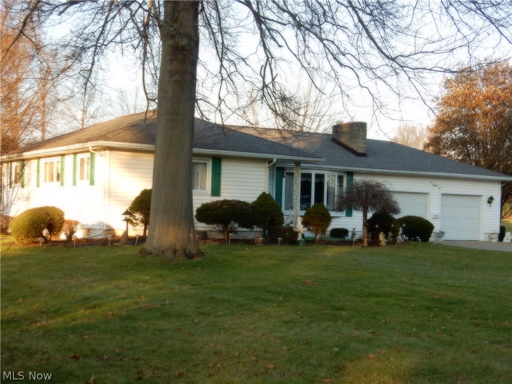 Beautiful, spacious ranch home situated on a well maintained 3/4 acre lot. This home has quite a story to tell. Built and loved by the same owners for the past 56+ years. This property has served it's current family well and there have been many fond memories made that will be cherished for years to come. The time has come though to pass it on so that another family can create memories of their own. There have been many updates over the years which include: Updated kitchen and dining area which opens nicely to the living room and additional living space in the family room, (lower level). You will find quality oak tongue and groove hard wood flooring under all carpet in the house as well as under the flooring in the dining area. Outside, you will appreciate the  updated windows and siding. The roof, gutters and downspouts were replaced in 2005 with 30 yr. shingles. The double concrete drive has a large turn-a-round and enters the over-sized 2 car garage and each door has an opener. Out
