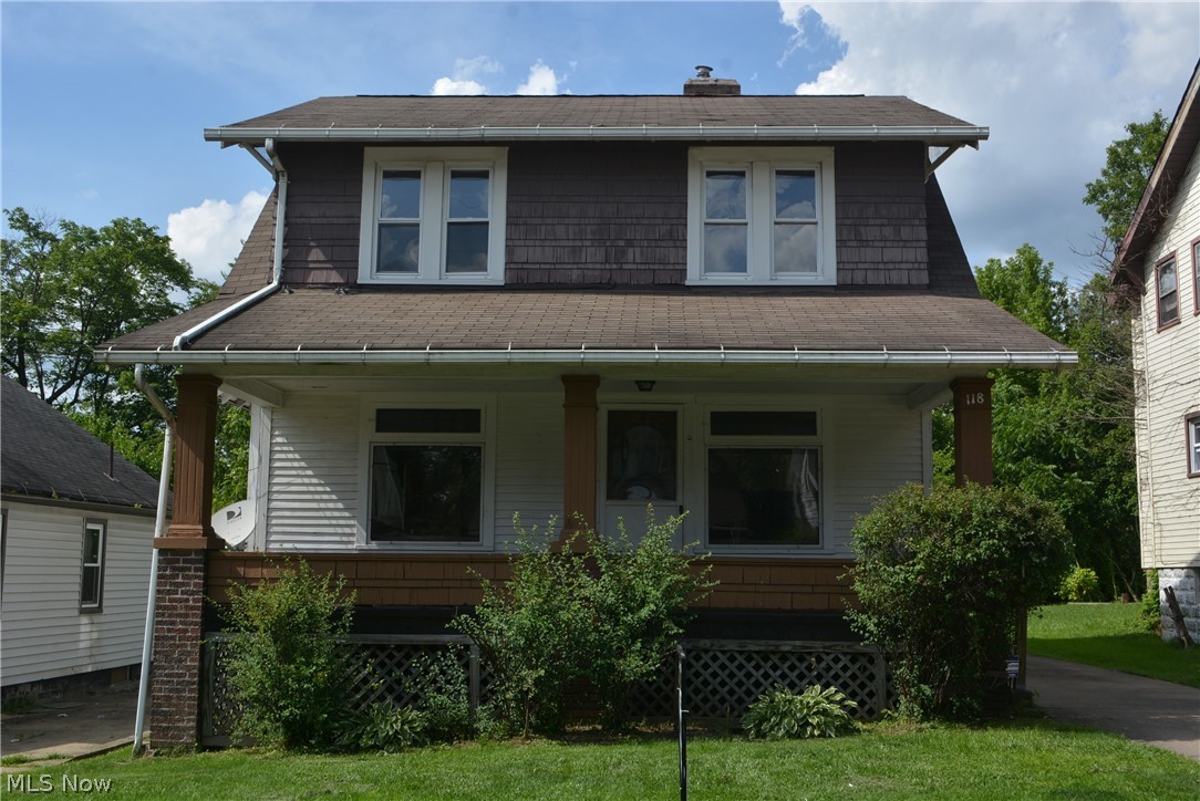 22 x 8 Covered Front Porch, Enclosed Back Porch,  Concrete Driveway, 2 Car Garage,  Replacement windows, glass block in basement.