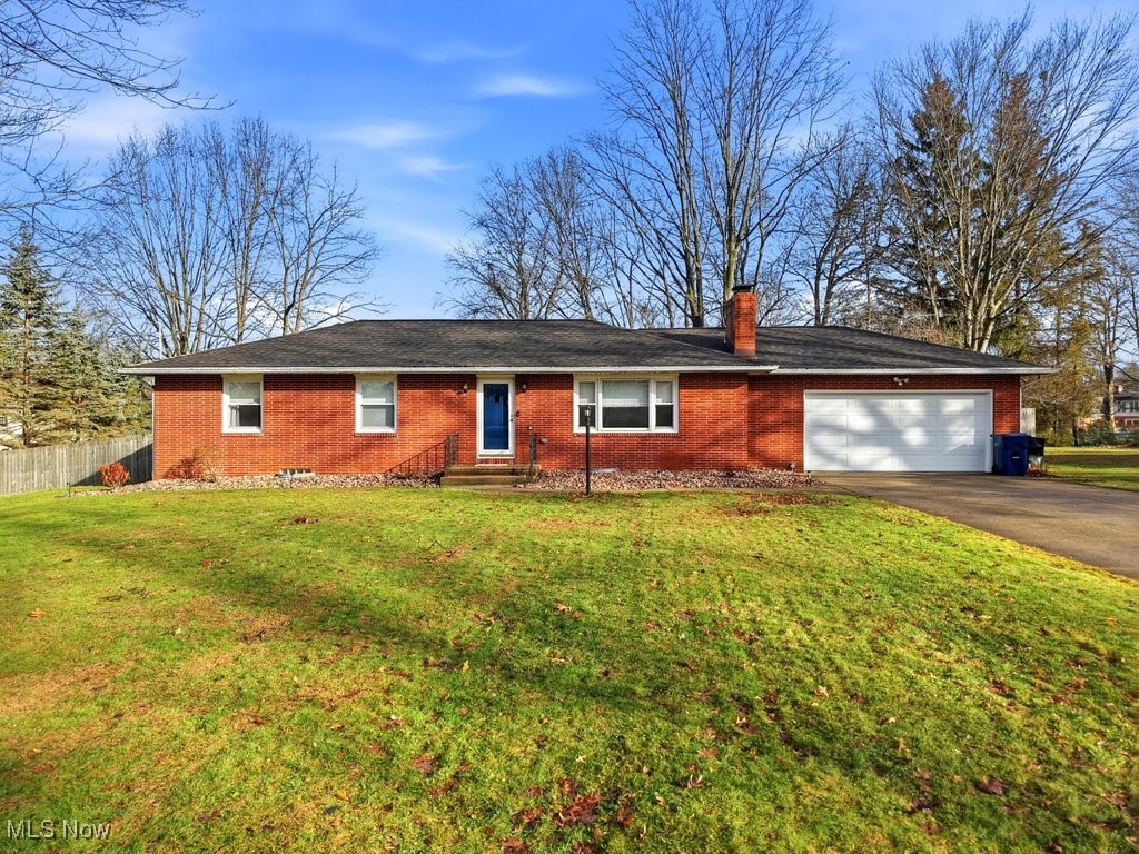 Welcome to your dream home!  This totally updated modern ranch is located in the beautiful Stillmeadow Estates.    First floor features a large living room with a cozy modern fireplace, three first-floor bedrooms (the master could also be a senior suite), dining room with double sliders leading to the back yard, and an eat-in kitchen!  There is a large pantry in the dining room cleverly hidden behind a new barn door.  The lower level is absolutely spectacular!  Huge 21 x 20 finished room with a bar, fireplace, & play area.  There are two additional rooms in the basement, an office, & laundry room.  Updates include the following:  bar, glass block windows, landscaping (tree + 10 bushes), fresh paint throughout, luxury vinyl flooring throughout, shiplap paneling, smart ecobee thermostat, ceiling fans, new light fixtures, updated lights & switches, bathroom fan-showerhead-hardware, 10 yr hardwired smoke detectors, ducts cleaned 2022, roof updated vent 2024, New AC 2025, H2O tank 2024, NEW Furnace 2023, new outside drain 2025, safety outlets throughout home, Fridge 2024, & Dishwasher 2024.  This home sits on 1/2 acre with a large front and backyard.  The private fenced-in backyard has a patio & fire pit that would cover all outdoor gatherings!   Located minutes away from the Tallmadge High School & Rec Center.   This home is truly a treasure, book your showing today!