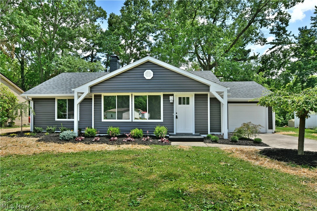 Welcome home to this stunning, fully renovated ranch nestled on a quiet private cul-de-sac with beautiful views overlooking Mill Creek Park. Everything is new—roof, siding, windows, furnace, central air, electrical panel, and hot water tank. Every bit of flooring, carpet, fixtures all new!

This spacious home offers 2 large bedrooms, 2 expansive living areas, and a flexible floor plan—the rear family/sunroom could easily be converted into a primary suite if desired.
The inviting front living room features a gorgeous brick fireplace and flows into the open kitchen with granite countertops, stainless steel appliances, a custom coffee bar, and designer tile backsplash. The sun-filled family room offers walls of windows showcasing peaceful park views, making it the perfect place to enjoy your morning coffee.
Down the hall are two spacious bedrooms, convenient laundry hookups, and a beautifully updated bathroom with custom tile and wood accents.
An attached garage with an oversized workshop adds even more functionality. Move right in and enjoy modern updates, flexible living space, and an unbeatable location!