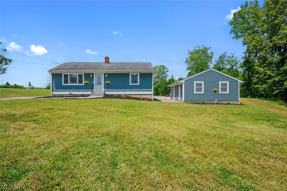 Rare opportunity to own a beautifully renovated “from the studs” Ranch home on more than 3.8 exceptionally private acres in Oakwood Village, offering modern updates & room to grow. Refinished original oak hardwood floors, an oversized detached 2-car garage w/ a dedicated 125-amp electrical subpanel & a home set back more than 325 ft from the road create a peaceful setting w/ views of surrounding open land & neighboring woods. A creek borders the north side of the property & the expansive acreage offers endless possibilities for a large outbuilding, workshop, additional garage space, gardens, hobby farm, outdoor entertaining, or a private retreat. This home features 3 bedrooms, 2 full baths & over 2,210 sq ft of living space including the fully finished lower level. The updated eat-in kitchen includes stainless steel appliances, abundant cabinetry, a breakfast bar & opens to the dining room w/ backyard access. A bright living room features a large picture window overlooking the property. The finished lower level adds exceptional living space w/ a spacious rec room, 3rd bedroom w/ egress window, full bath, laundry area & flexible spaces for a home office, fitness room, playroom, media room, or guest suite. Numerous owner updates provide peace of mind including public water & sewer, exterior basement waterproofing, an efficient heat pump & 200-amp electrical service. UPDATES COMPLETED IN 2026 include: completely finished basement, custom laundry area, updated basement bathroom, egress windows & sliding doors, landscaping, replaced/added driveway stone, interior paint & more. A detailed list of updates is available upon request. INCLUDED are ALL kitchen appliances & washer/dryer. Conveniently located near I-480, I-271, OH-14, shopping, restaurants, parks & other local attractions. Properties offering nearly 4 private acres, modern updates, public utilities & convenience in this location rarely become available.