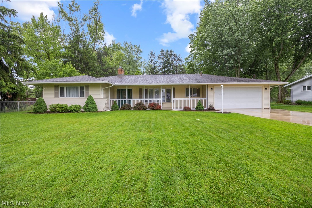 Welcome home to this absolutely charming 3-bedroom, 2 bathroom ranch nestled in North Royalton! From the moment you arrive, you'll fall in love with the cozy covered front porch, beautiful large lot, patio, incredible curb appeal and a warm welcome-home feeling. Inside, this move-in-ready gem is filled with amazing natural light and thoughtfully updated throughout, creating a bright, modern, and inviting atmosphere. The large modern kitchen features granite countertops, stainless steel appliances, and offers the perfect space for daily needs and entertaining friends & family. The movable island cart, all appliances, & additional storage cabinets stay. A beautifully updated main bathroom features a stylish tile shower, double sinks, and modern finishes adding a fresh and timeless touch. All three bedrooms are generously sized, offering comfortable living, flexibility, and ample space to relax and unwind. An open and easily accessible laundry space, featuring a utility sink, includes a new washer and dryer (2025). An additional full bath is off the laundry room and garage entry into the home. The spacious family room overlooks the backyard. Step outside to your fully fenced backyard retreat complete with a patio ideal for entertaining or peaceful relaxation. A backyard shed provides additional storage, while the attached garage adds convenience year-round. Many major updates, including flooring & fresh paint throughout in 2025, New HVAC 2018, Gutter & Downspouts 2018, New Driveway 2019, and so much more offer the next owner added peace of mind. Perfectly located near shopping, dining, medical facilities, parks, and schools, this home combines comfort, convenience, and charm! One year home warranty added for extra peace of mind! Whether you are a first-time home buyer, downsizing, or simply searching for that special place that feels like home the moment you walk in, this is the one.  Schedule your tour today!
