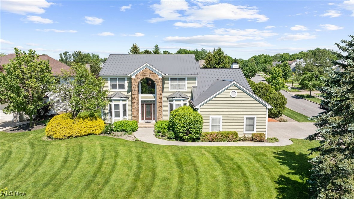 Nestled in Chagrin Falls, this gem of a house is a true wonder with 4 full baths and a 3 car garage. That’s only the beginning. This lovely home sits on a large property surrounded by iron fencing and trees for added privacy. Step inside your new home! The new dazzling hardwood floors run throughout the house. The spacious family room has a high slanted ceiling and features an elegant fireplace with custom made wall units on either side. This lovely family room is also equipped with surround sound for movie nights. Gorgeous granite countertops and backsplash in kitchen. The walls in the master bedroom are beautifully lined with crown molding. All bathrooms in the house have been updated with brand new vanities, mirrors and lighting. Upstairs holds an office space for those who like to work from home as well as a single bedroom. Finished basement has plenty including a tv area with surround sound, bar/kitchenette, a full bath and bedroom! Above the garage there is a closet and storage area which is accessible from the office. Other updates to this home include a new metal roof, window shades, high end tile as well as replaced lighting in the kitchen, dining room, foyer and a new chandelier in the dinette. Outdoors, we have beautifully maintained landscaping with a lovely water feature trickling into a koi pond. The pergola has a retractable cover for sunny days. Gather friends and family on the patio and cook fresh meals in the outdoor kitchen! Or soak in the outdoor hot tub on quiet evenings. This masterpiece home is located only minutes away from Pinecrest, Legacy Village, Beachwood Place and South Chagrin Reservation as well as world class hospitals such as Cleveland Clinic and the top rated public schools. Don’t wait to live in luxury today!