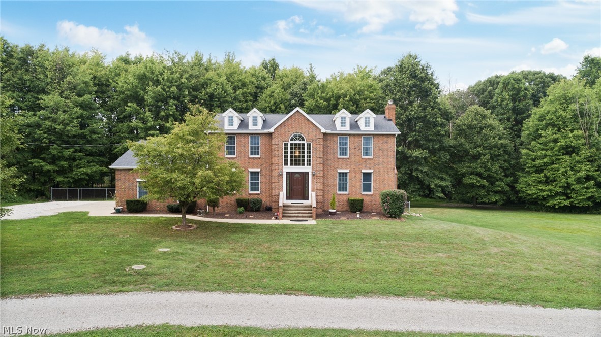 Welcome to this high quality constructed, one owner, spacious four bedroom 2 & ½ bath home situated on 8 private acres in Diamond, Ohio (Palymra Township).  This property is the complete package with a beautiful aerated pond, attached three car garage and a large 36x32 outbuilding/barn with second story, overhead garage doors & concrete flooring! No expense was spared when these owners built this home.  The custom limestone fireplace with Walnut mantle really is quite the show-stopper upon entering through the custom Pella door into the home’s two story foyer.  This home was built with ¾” solid oak flooring, solid oak trim and doors throughout the whole home and the kitchen has new stainless appliances! The master bedroom boasts cathedral ceilings with uniquely designed dormers that allow you to enjoy the natural sunlight, evening stars and none of the worry that comes along with skylights! This home has 40 year dimensional shingles that were replaced in 2010.  This home also has a wal
