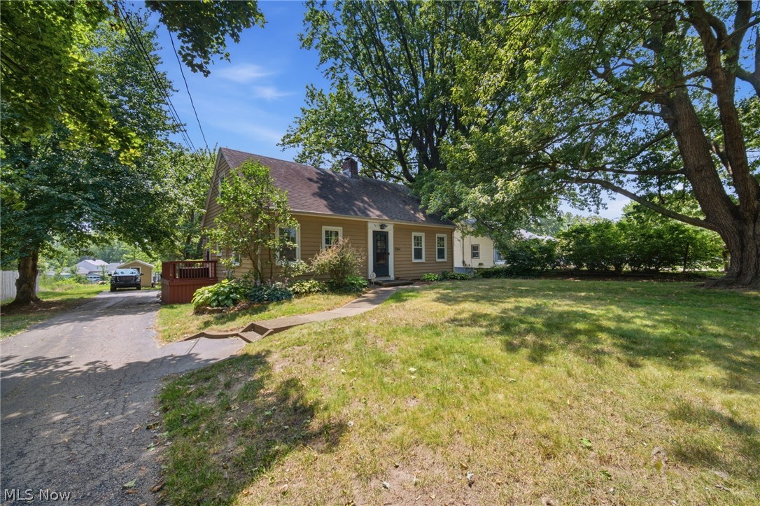 Enjoy the space and privacy of this charming 3-bedroom, 1.5-bath Cape Cod located in Ashtabula Township. Situated on over a half-acre of property, this home offers a peaceful setting with a spacious backyard, patio area, storage shed, and plenty of room to relax, entertain, or enjoy the outdoors. Inside, the open floor plan provides a comfortable flow between the living spaces, with hardwood floors adding warmth and character throughout.
The inviting living room features a cozy fireplace, creating a great space to gather. A deck overlooking the backyard provides the perfect spot to enjoy the scenic surroundings. Additional features include an attached garage and a full basement offering ample storage space or potential for future use. With its generous lot size, quiet setting, and classic Cape Cod charm, this home is a wonderful opportunity for buyers looking for space, comfort, and a little room to spread out.