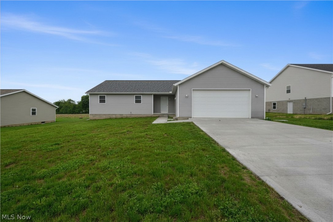 Why wait through the stress and delays of construction when you can move right into this pristine, open-concept ranch home built in 2025? Situated on a beautiful lot overlooking picturesque farmfields, this property offers a front-row seat to breathtaking evening sunsets right from your own backyard. Designed with modern entertaining in mind, the heart of the home features a seamless flow between the spacious living, dining, and kitchen areas. The kitchen comes fully equipped with all appliances to stay for the new owner, making your transition effortless. Just off the main living space, a rear deck steps down to a perfectly flat yard, creating an ideal setting for summer barbecues, outdoor games, or simply relaxing as the sun goes down. A private primary suite, complete with its own dedicated ensuite bathroom for a true retreat, makes the layout ideal. Two additional bedrooms and a second full bath offer plenty of space for family or guests. Convenience is key with a dedicated first-floor laundry room. Spacious two-car attached garage. If you need room to grow, the massive, unfinished basement serves as a blank canvas ready to be transformed into a home gym, recreation room, or extra storage. Immediate possession available. Tusky Valley Schools. Skip the building process and start enjoying the peaceful country views today!