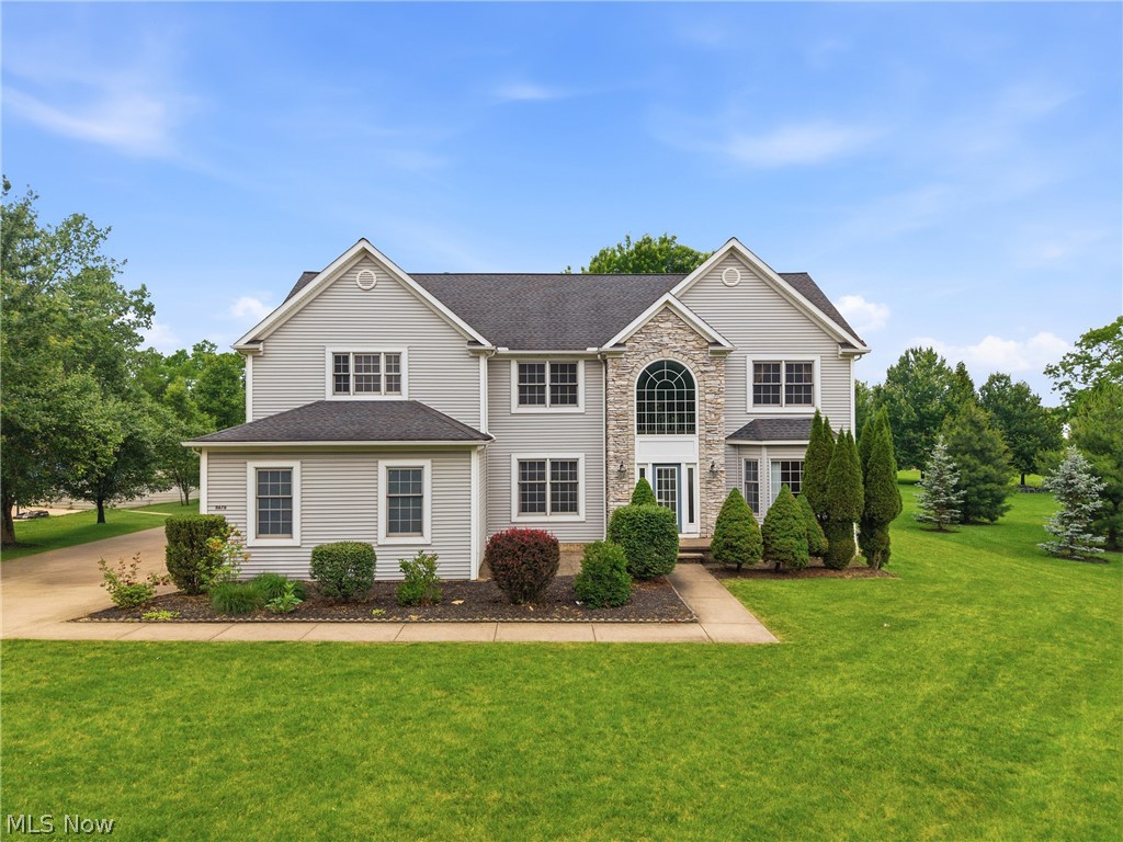 Welcome to 11678 Dunham Rd., a beautiful well maintained home  situated on a private 1 acre lot.
This exceptional residence combines tradional elegance with modern comfort offering a versatile floor plan designed for everyday living and entertaining. The heart of the home is an updated kitchen with ample cabinetry, quartz countertops, generaous prep space and a layout that flows seamlessly to the large two-story family room.  The dramatic two-story family room brings abundannce of natural light and a true sense of space, creating an impressive centerpiece for relaxing and entertaining.  The main level includes a convenient bonus bedroom ideal for guests, or a home office.  The formal dining room is spacious with tray ceiling.  The formal living room offers a nice bay window. Upstairs you will find the remaining bedrooms allowing privacy and a peaceful retreat for family members.  The master bath offers two vanities and a jacuzzi tub. You will also find a convenient jack and jill bathroom.   The lower level offers large areas for recreation and also is complete with a large kitchen space fully equipped with appliances. There is also a full bath located in this lower level. Outside the property offers a private yard and outdoor space ready for summer enjoyment and gardening and includes a large deck and a 3-car garage. This home has so much to offer with all the ability to entertain indoors and outdoors with its park like setting. Located near local amenities and commuter routes, this home blends suburban tranquility with everyday convenience.  Call now to schedule your showing and make this your next address.