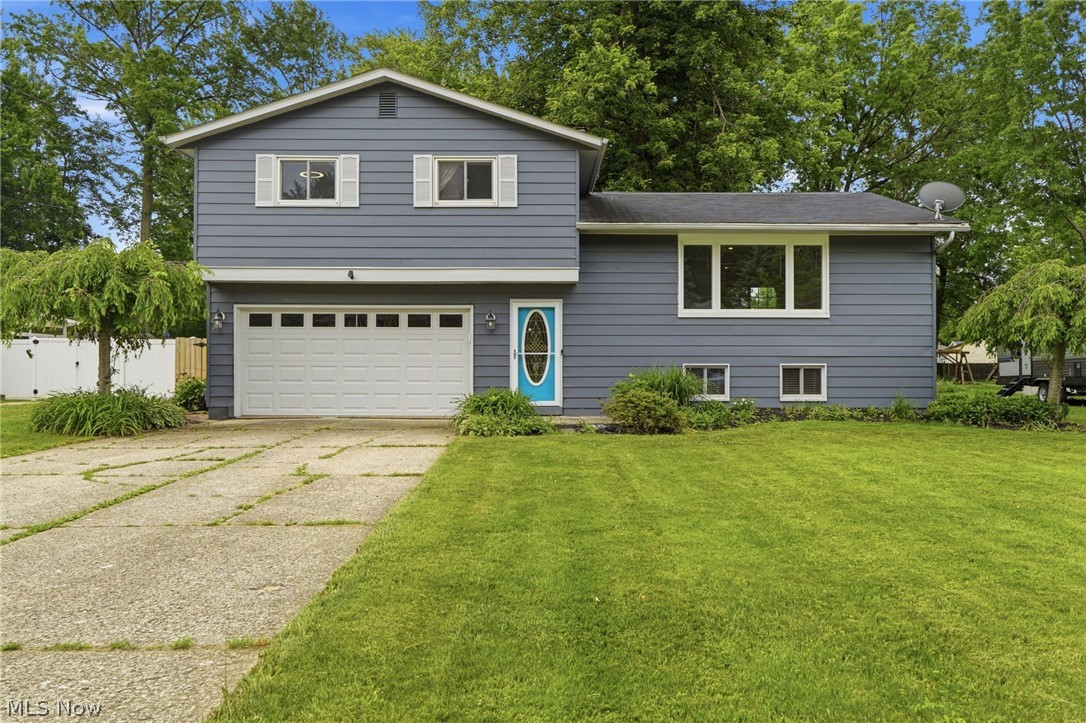 Welcome home to this beautifully updated split-level situated on a quiet cul-de-sac in Mentor. The main level features an open-concept layout connecting the living room, dining area, and completely remodeled kitchen with white cabinetry, soft-close drawers, and a full suite of stainless steel appliances. Updated bathrooms, luxury vinyl plank flooring, and recessed lighting add to the home’s modern appeal.

The lower level offers a spacious family room, perfect for entertaining, along with a large laundry and storage area.

Step outside and enjoy the incredible backyard featuring a privacy fence, dedicated dog run, fire pit, covered patio, and a 16’ x 12’ deck overlooking the yard.

Conveniently located near shopping, parks, schools, and all that Mentor has to offer. Home warranty included for added peace of mind.
