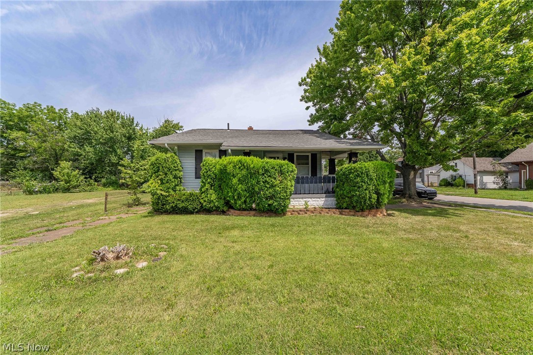Charming ranch on Lorain's west side, featuring a bright living room with hardwood-style floors, crown molding, and a bonus finished basement rec room for extra living space. The standout is the oversized two-car garage with built-in workbench and shelving — perfect for hobbyists or extra storage. Enjoy a covered front porch, mature landscaping, on a quiet, tree-lined street. Just minutes from Lakeview Park, downtown Lorain, and Route 2/I-90 for an easy commute. Priced at $89,900 to reflect some TLC and repairs, this is an affordable opportunity for first-time buyers or investors alike — schedule your showing today!