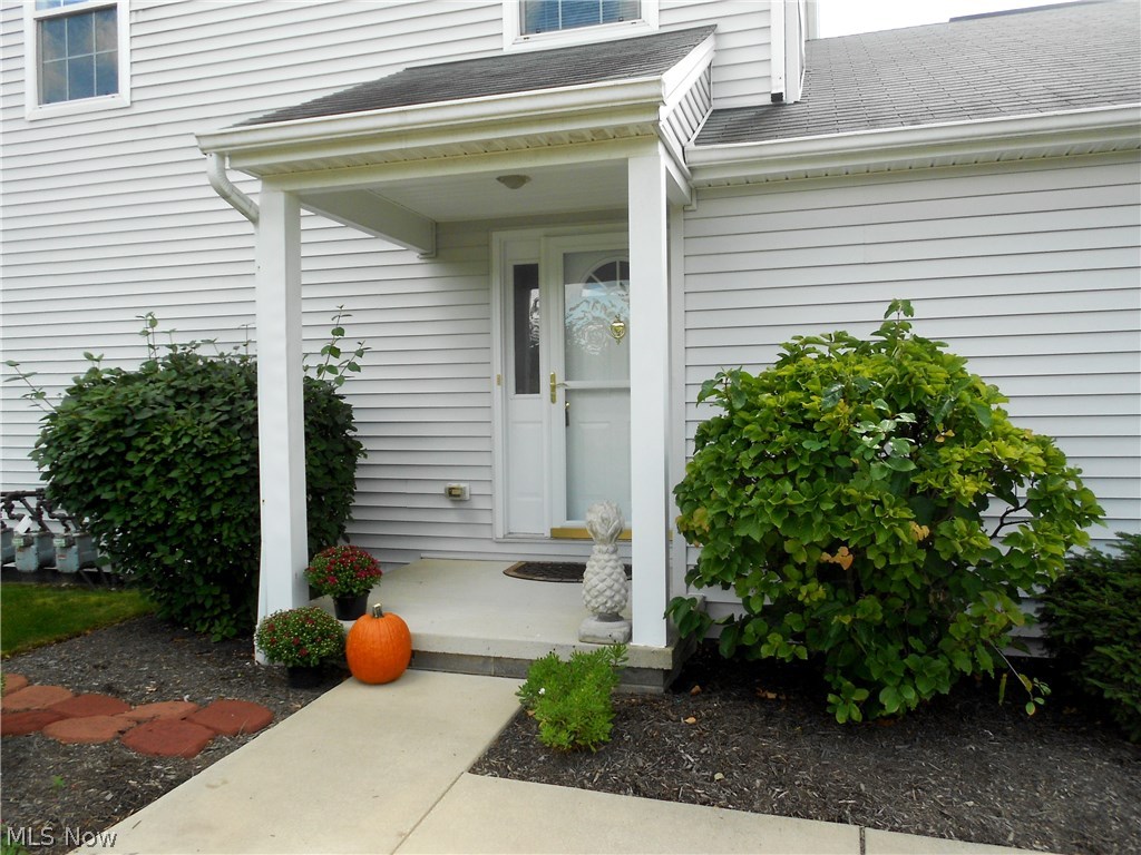 Absolutely pristine and rarely available private end unit with 2 car attached garage!!  This lovely home offers a stylish decor with freshly painted neutral colors and an open floor plan.  The first floor features a powder room and living room with custom blinds, gas fireplace and sliders to the private fenced in patio with gorgeous wooded views...the perfect area for relaxing, grilling and entertaining.  Included on the first floor is the beautiful kitchen offering plenty of maple cabinets, counter space and black appliances.  Upstairs you will find a full bath and 2 vaulted bedrooms both with double closets.  The master bedroom also includes custom made blinds.  The lower level is wired for surround sound; it's ideal for a recreation/media/office/exercise room and features a full bath.  As a bonus, the Samsung front loading washer and dryer are included with this property.  A pull down ladder offers easy access to additional storage in the attic above the garage.  Located close to sh