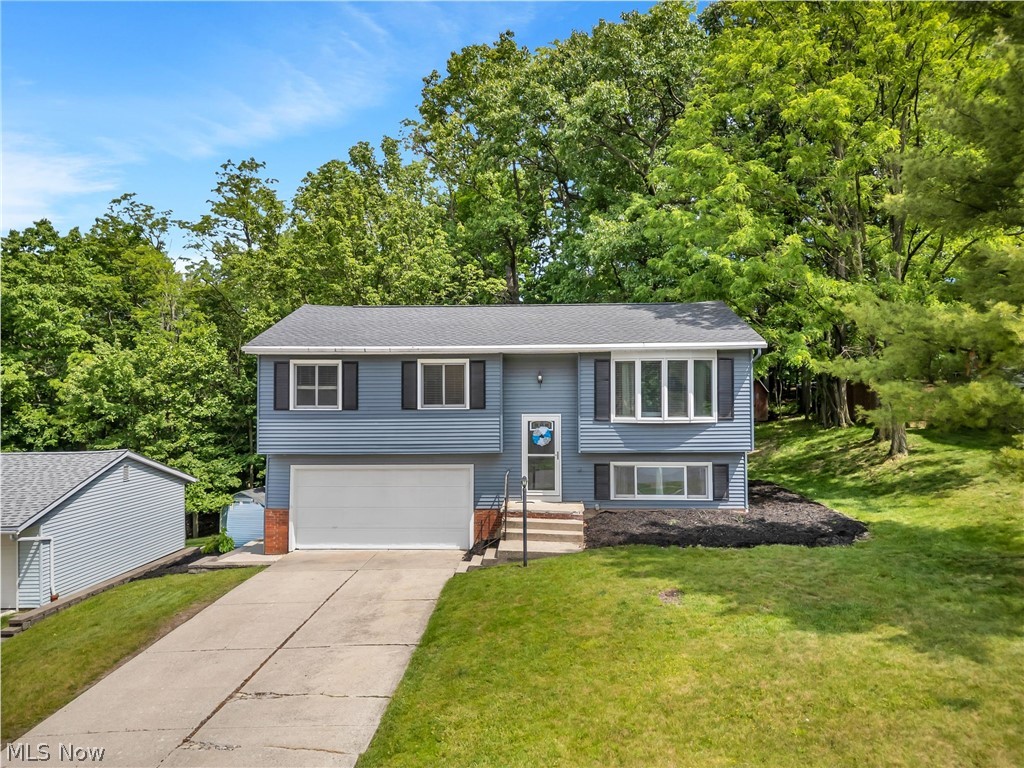 Welcome to 9412 Munich Drive! This beautifully updated 3-bedroom, 1.5-bath bi-level home is nestled in a desirable Parma neighborhood and offers exceptional living space both inside and out. With numerous recent updates, this home is truly move-in ready.

Upon entry, you’re welcomed by a spacious foyer with access to both the main and lower levels. The lower level provides versatile additional living space featuring newer vinyl flooring, a half bath, laundry area, and direct access to the attached garage. Whether you’re looking for a home office, recreation room, workout space, or additional entertaining area, this flexible space adapts to your lifestyle.

Upstairs, the main level is filled with natural light from expansive living room windows, creating a bright and inviting atmosphere. The open-concept layout seamlessly connects the living room, dining area, and kitchen—perfect for both everyday living and entertaining. The kitchen is a true showpiece, featuring newer cabinetry and appliances, luxurious dolomite natural stone countertops, and a convenient serving counter. Sliding doors lead directly to the deck, effortlessly blending indoor and outdoor living.

The main level is completed by three spacious bedrooms and a full bathroom.

Step outside to your own private retreat—a beautifully maintained two-tier deck perfect for relaxing evenings, entertaining guests, or enjoying the outdoors. From the attached garage and versatile lower level to the light-filled open-concept main floor and impressive outdoor living space, every detail of this home is designed for comfort, style, and everyday functionality. This is more than a home—it’s a place to truly enjoy and make your own.

Conveniently located near parks, shopping, dining, and major highways, this is a home you won’t want to miss. Schedule your private showing today!