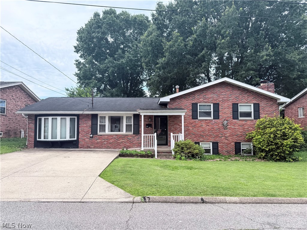 Multi-Level home in desirable Vienna neighborhood, convenient to shopping and many amenities. If you need a lot of space this is the home for you. FIVE Generously sized bedrooms, FOUR full baths. Beautiful kitchen with an abundance of cabinetry, large stainless steel refrigerator, smooth top electric range, and dishwasher. Huge main floor primary bedroom suite with large walk-in closet and spacious primary bathroom. Three bedrooms on the upper level, one of which has a full bath and could be considered an additional primary bedroom, there is another full bath located in the hallway on this level. There is a nicely sized living room on the main floor. The basement features a huge recreation room with stone WBFP, another bedroom and another full bath. There is an additional lower level that is unfinished where you'll have access to the utility room. This home has steam heat but also has central AC. Lovely fenced backyard which is mostly level, small back deck and storage building. Off street parking on paved driveway. Home being sold As-Is by Corporate Seller. 
Bring your own finishing touches to this lovely home and make it your own!