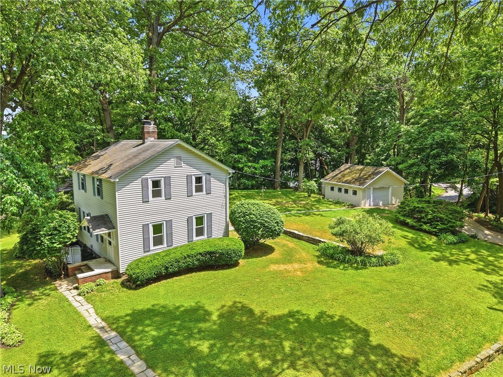 Incredible Portage Lakes opportunity with optional membership to Shore Acres for possible boat slip & beach access at East Reservoir (One of two speed zones in Portage Lakes). This lovely home sits on 2 parcels for a total of .3724 acres of land all tied in to City Water and Sewer. Enter to newly refinished hardwood floors throughout the first floor that shine throughout the living room, dining room and solarium. The spacious living room features a stone woodburning fireplace. The dining room offers plenty of space for a large table and many memories- all open to the solarium bonus room with tons of windows and newly refinished hardwood- this space is perfect for an office, toy room, craft space or any flex need you may have. The kitchen maintains the charm of this 1933 lake home with incredible vintage decor- complemented with brand new LVT flooring.The french door refrigerator and spacious oven stay with the home. Upstairs enjoy 3 bedrooms including a master bedroom with views of the lake and a walk in closet. The full bathroom has tile flooring and a shower/tub. Ceiling fans in all bedrooms and great built in storage in the hall for function and character. The unfinished basement includes tons of storage space and the laundry area w utility sink - gas and electric dryer hookup. Updates include” ‘26 Refinish hardwood, Carpet on steps and hallway, Kitchen LVP. ‘21 Windows (Double Pane tilt in for easy cleaning). ‘18 Furnace & AC. ‘16 Bathroom shower, fan, vanity. The outdoor space includes a beautiful paver patio w barns stone landscape. The large 22x18 garage has a one car overhead door plus electric, opener, concrete floor and utility door. Come enjoy Portage Lakes!