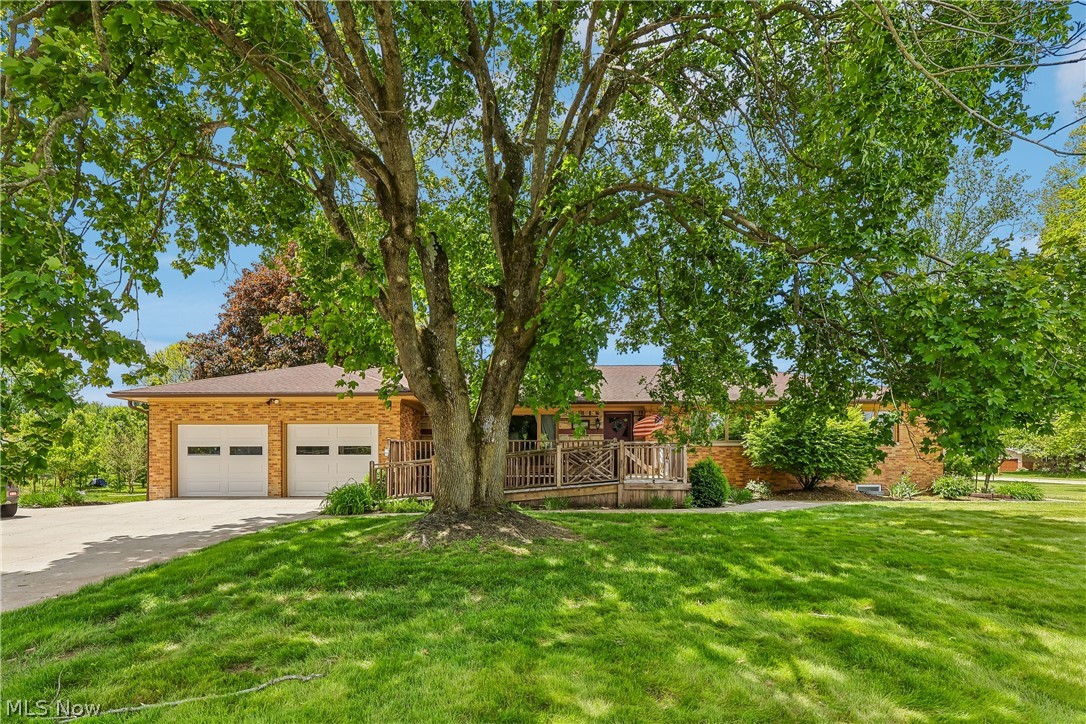 Welcome to this beautifully maintained all-brick ranch offering over 4 bedrooms and 3.5 baths, thoughtfully designed for comfortable first-floor living. The inviting floor plan features a private home office, spacious living room with a gas fireplace, formal dining room, and a fully equipped kitchen with stainless steel appliances and a sunny dinette area. The sunroom provides the perfect place to relax and enjoy peaceful views of the grounds and walking path. The bedroom wing includes a convenient Jack-and-Jill bath. The finished lower level is ideal for entertaining or multigenerational living, complete with a dressing room and full bath. Additional highlights include on-site laundry, a welcoming covered front porch with a wheelchair ramp, a two-car attached garage with hot and cold water and new garage doors (2026), and parking for up to eight vehicles or an RV. Recent updates include new central air (2023) and hot water tank (2024). A rare opportunity to own a solid, well-cared-for home in a prime location. Home is currently used as an assisted living facility.